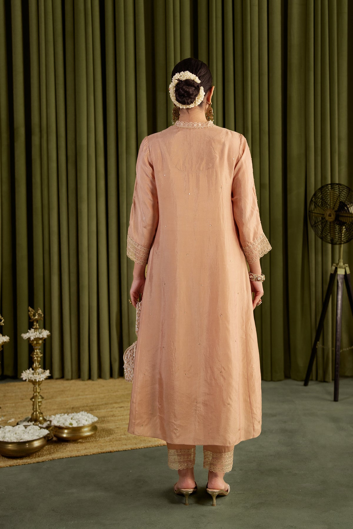 Golden beige kurta set with delicate floral embroidery.