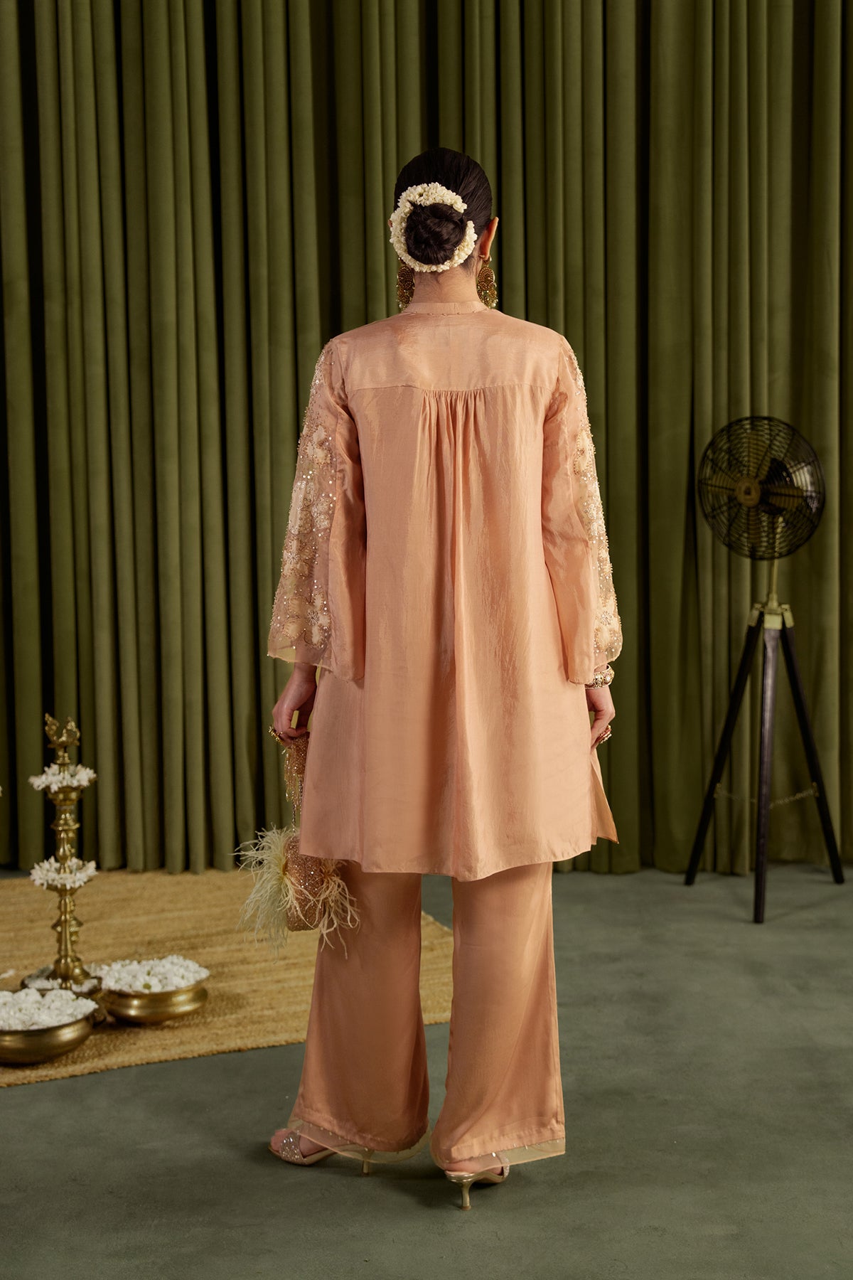 Golden beige co-ord set with embroidered floral pattern.