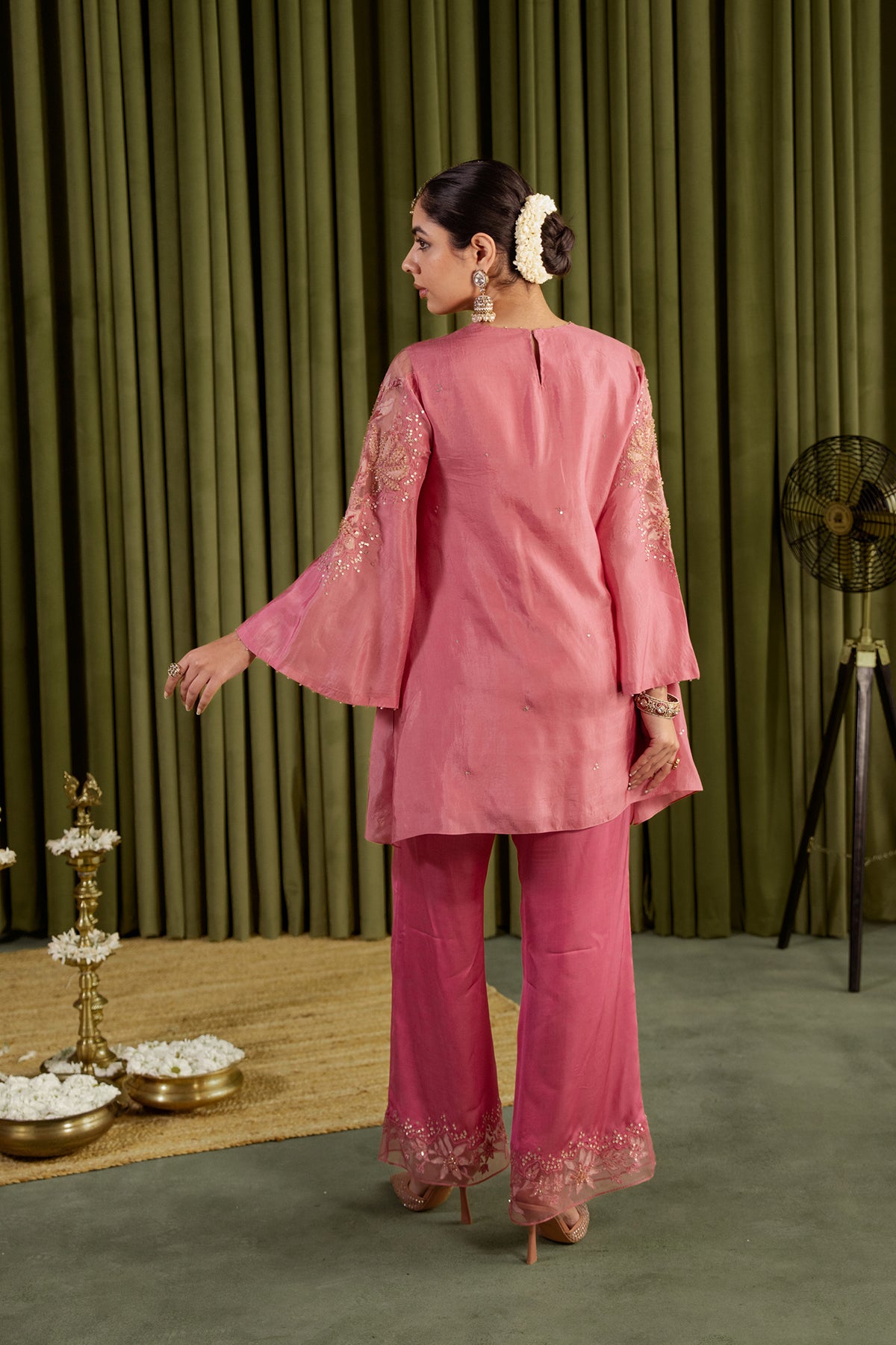 Rose pink co-ord set with embroidered magnolia flower pattern.