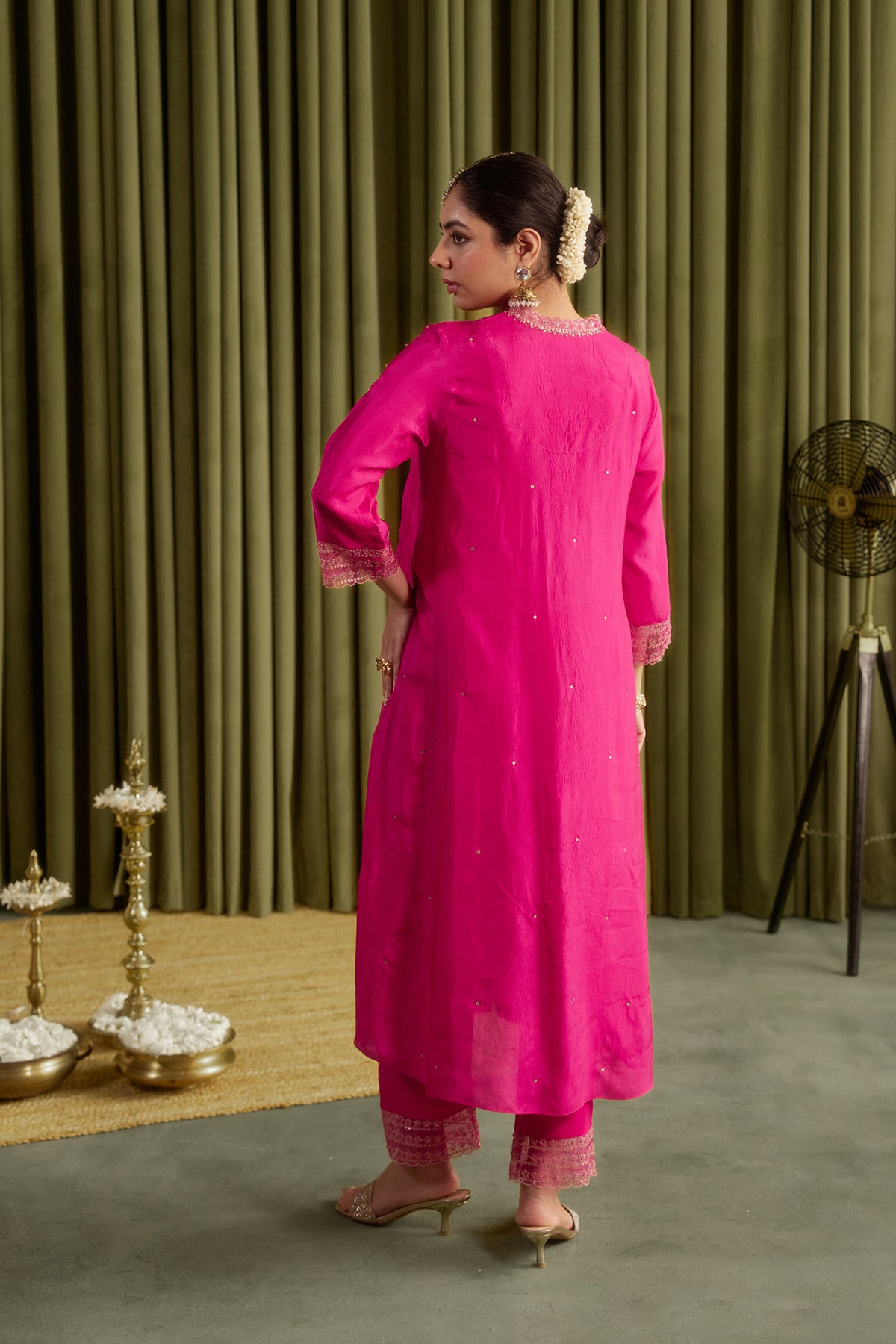 Hot pink kurta set with delicate floral embroidery.