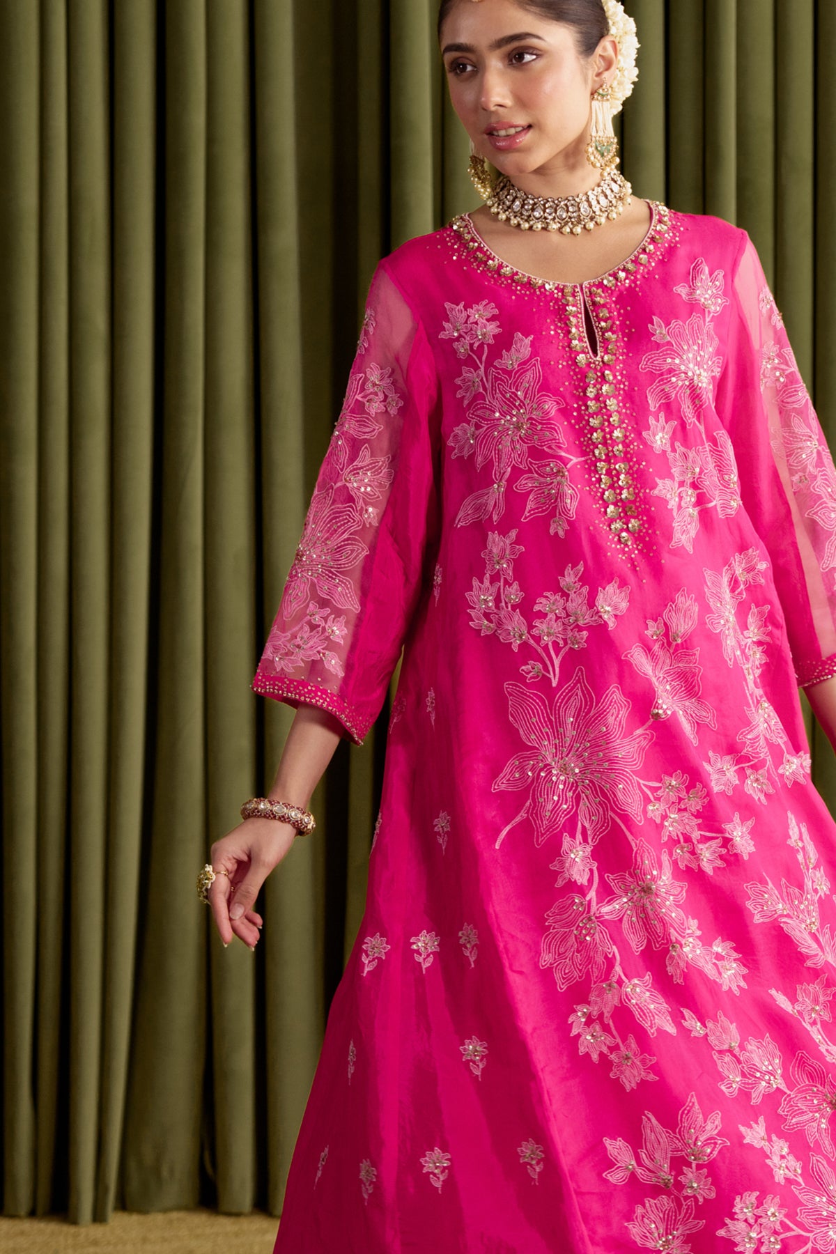 Hot pink kalidar kurta set with delicate floral embroidery.