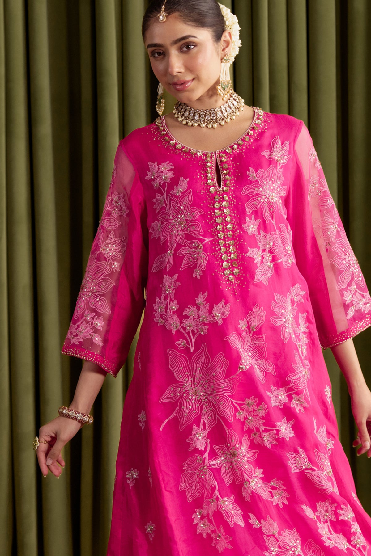 Hot pink kalidar kurta set with delicate floral embroidery.