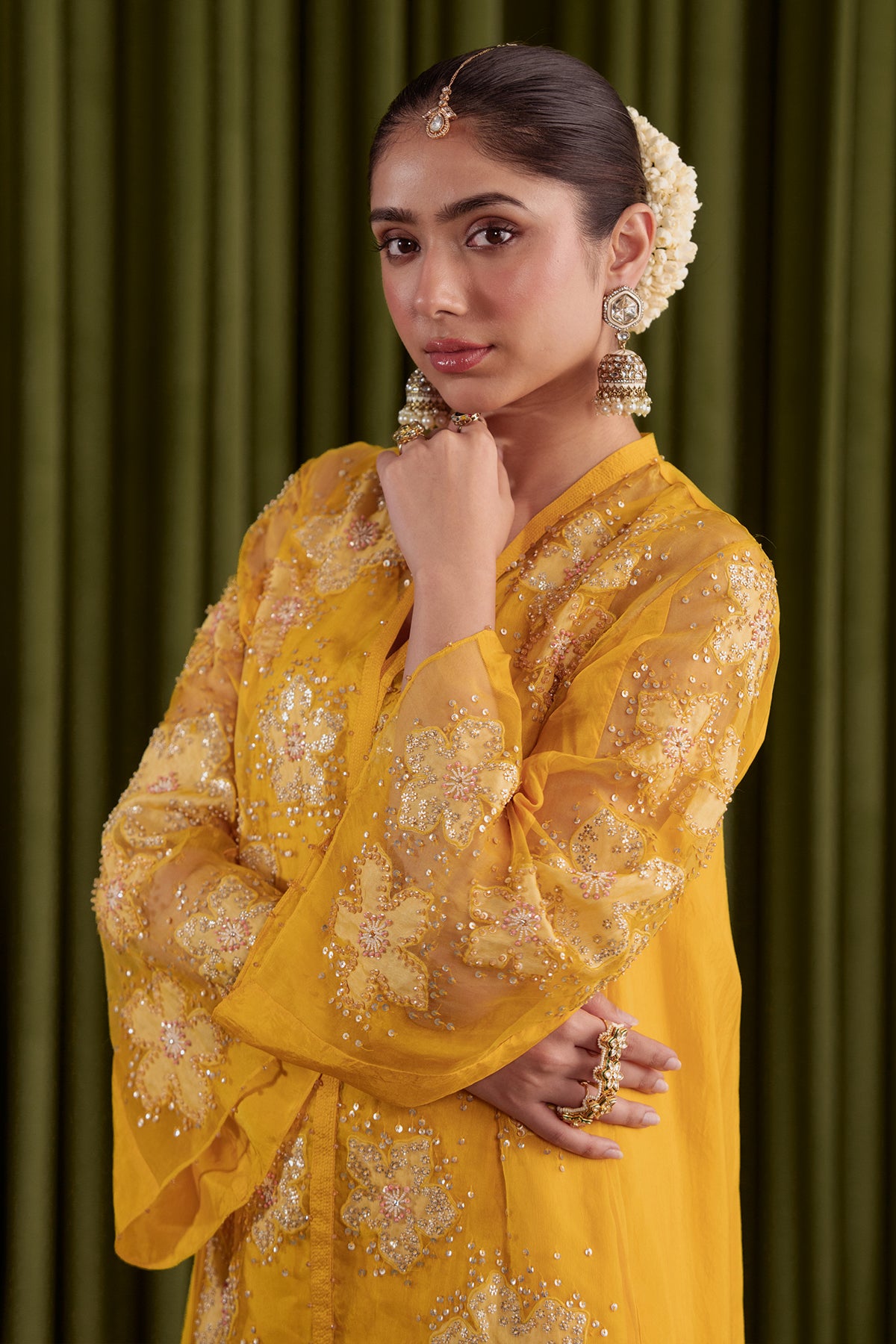 Golden beige co-ord set with embroidered floral pattern.