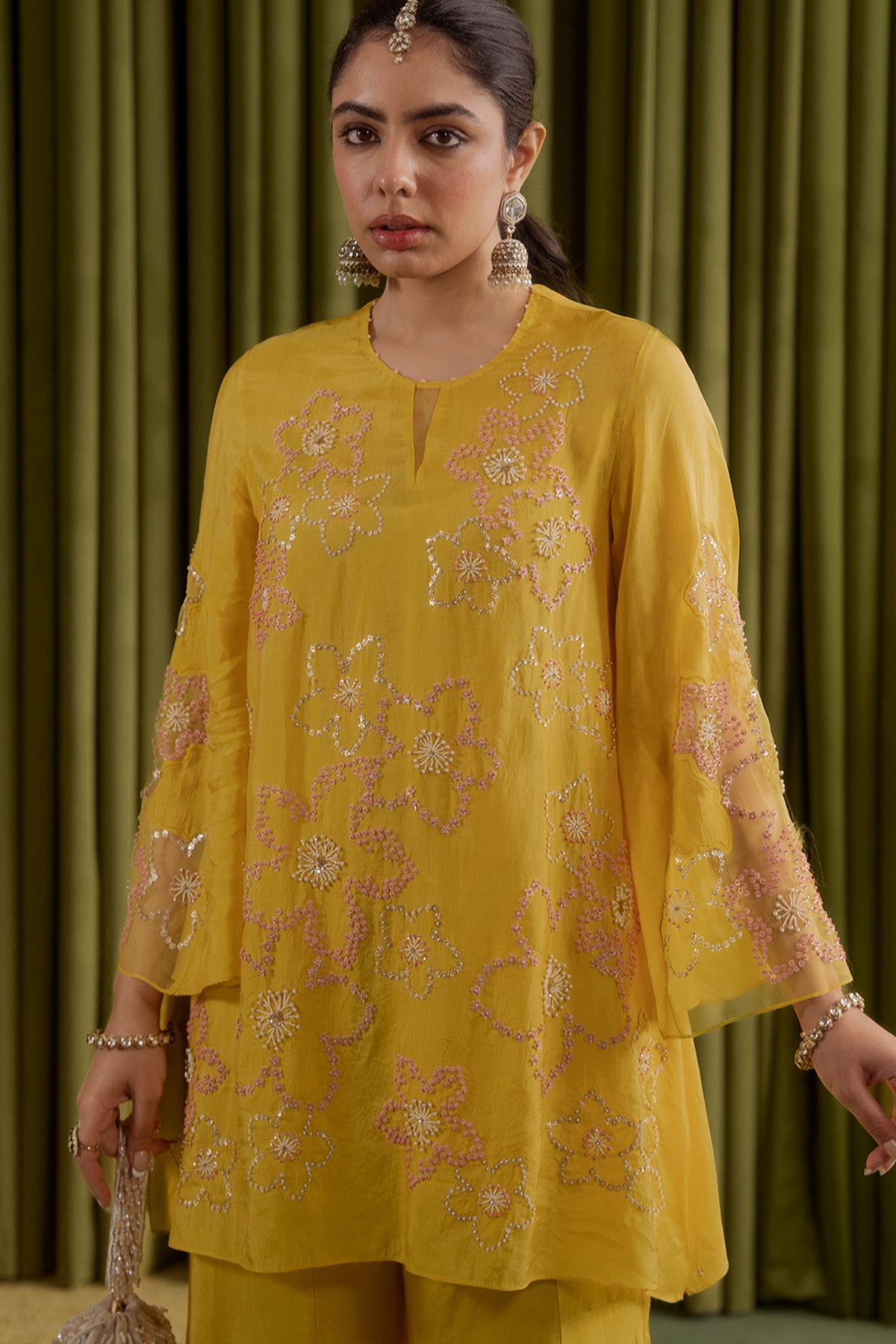 Mango sharara set with hand embroidered floral pattern.