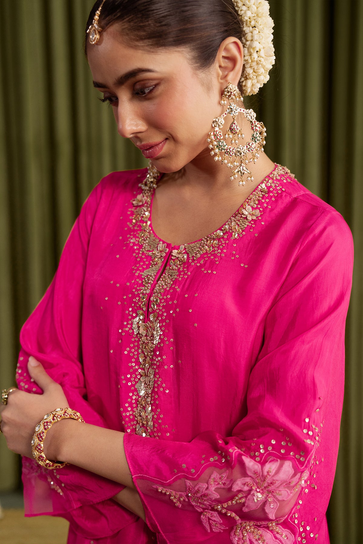 Hot pink kurta set in viscose silk base with embroidered magnolia flower pattern.