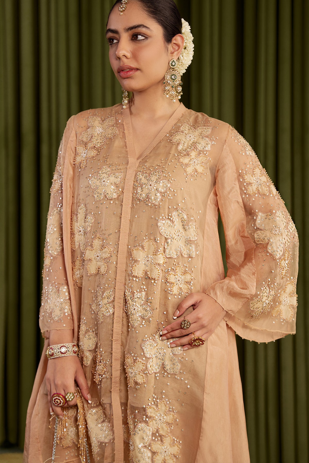 Golden beige co-ord set with embroidered floral pattern.