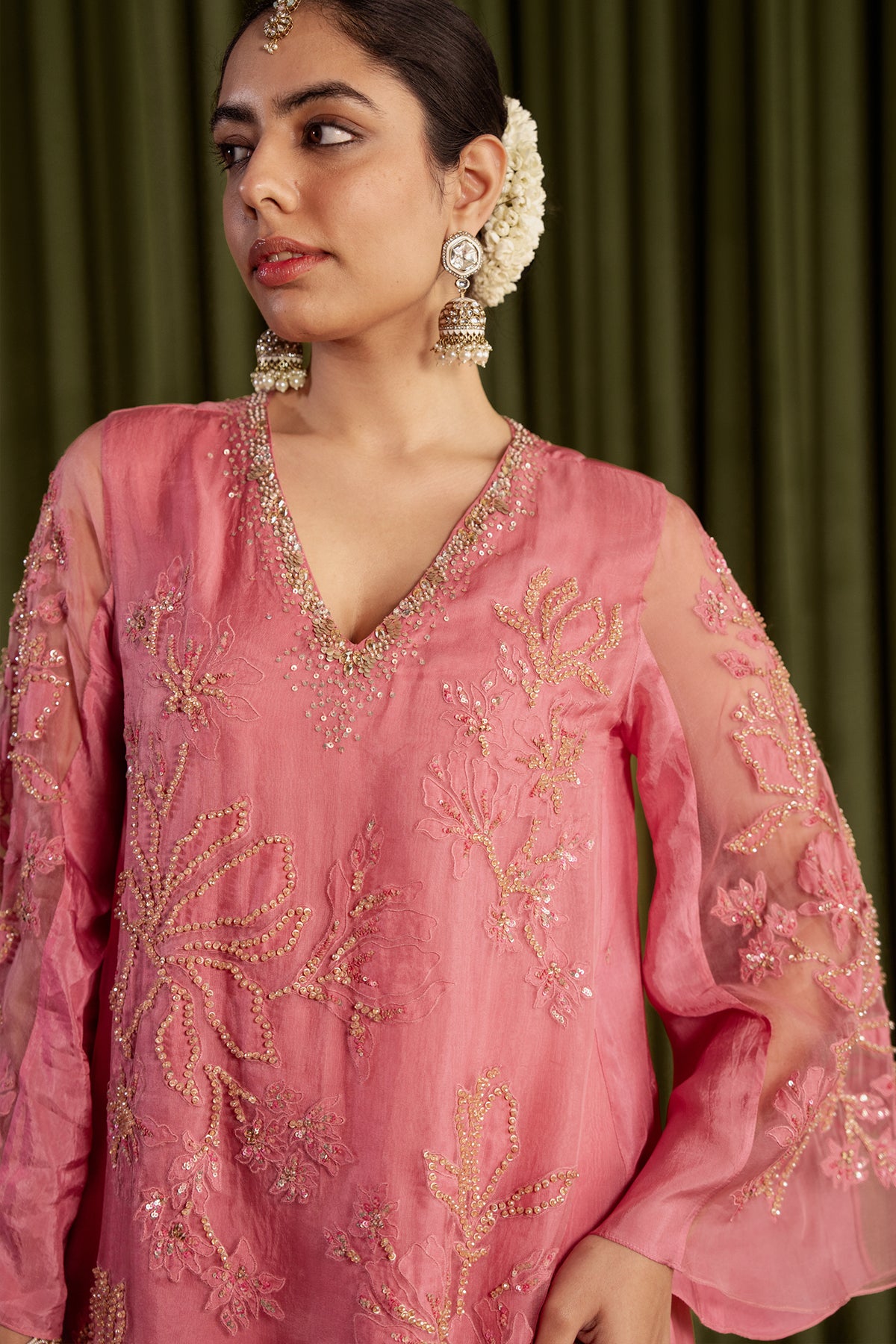 Rose pink sharara set with embroidered magnolia flower pattern.