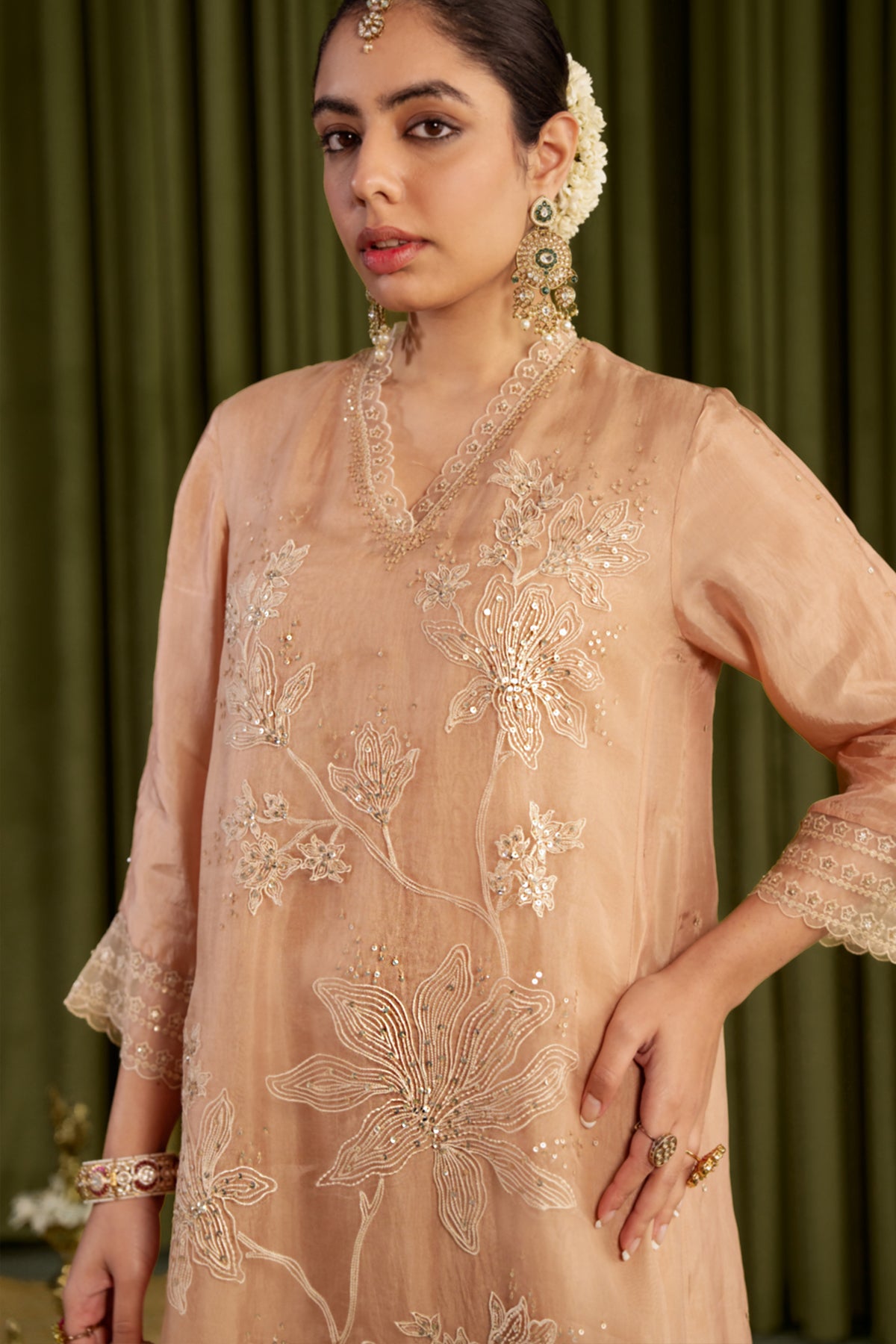 Golden beige kurta set with delicate floral embroidery.