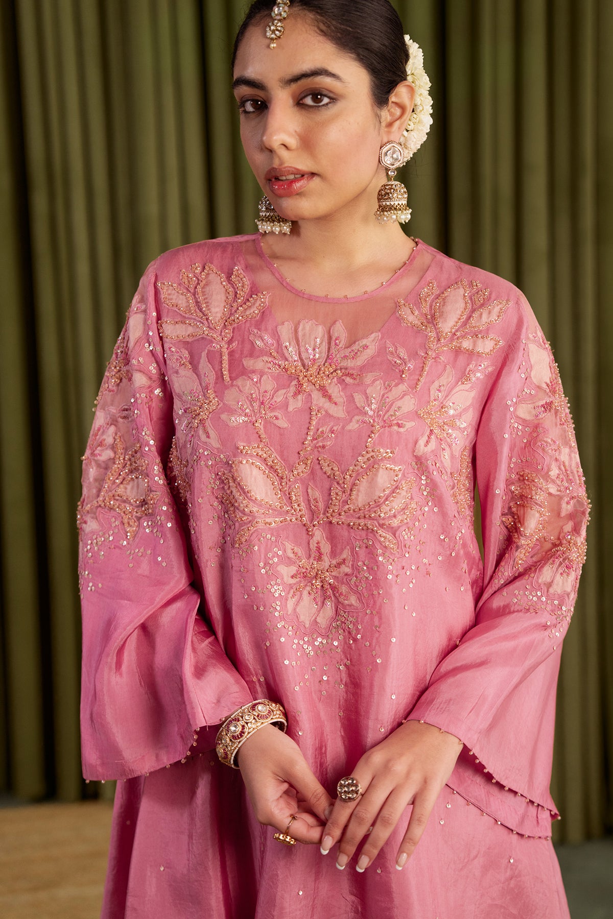 Rose pink co-ord set with embroidered magnolia flower pattern.