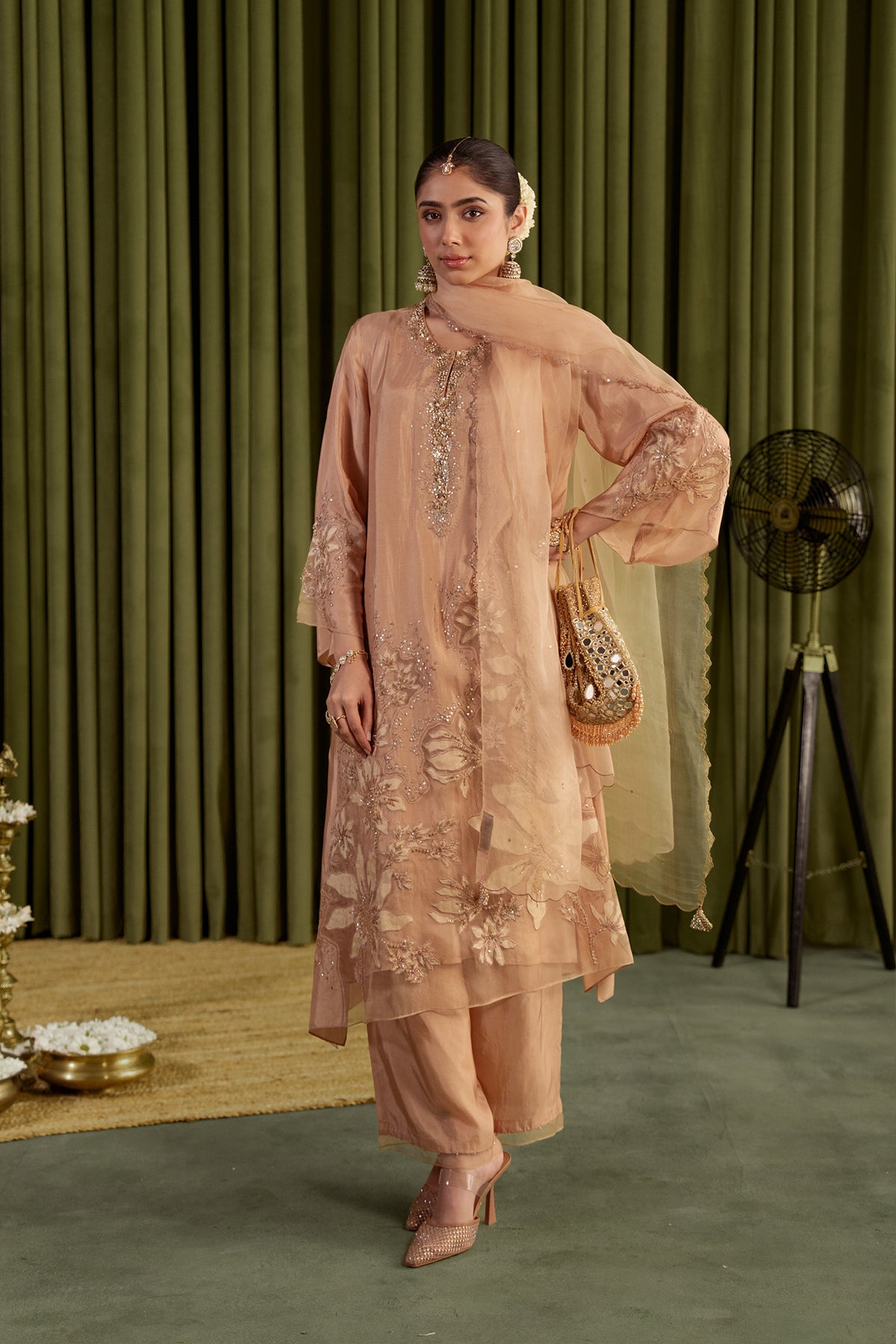 Golden beige kurta set in viscose silk base with embroidered magnolia flower pattern.