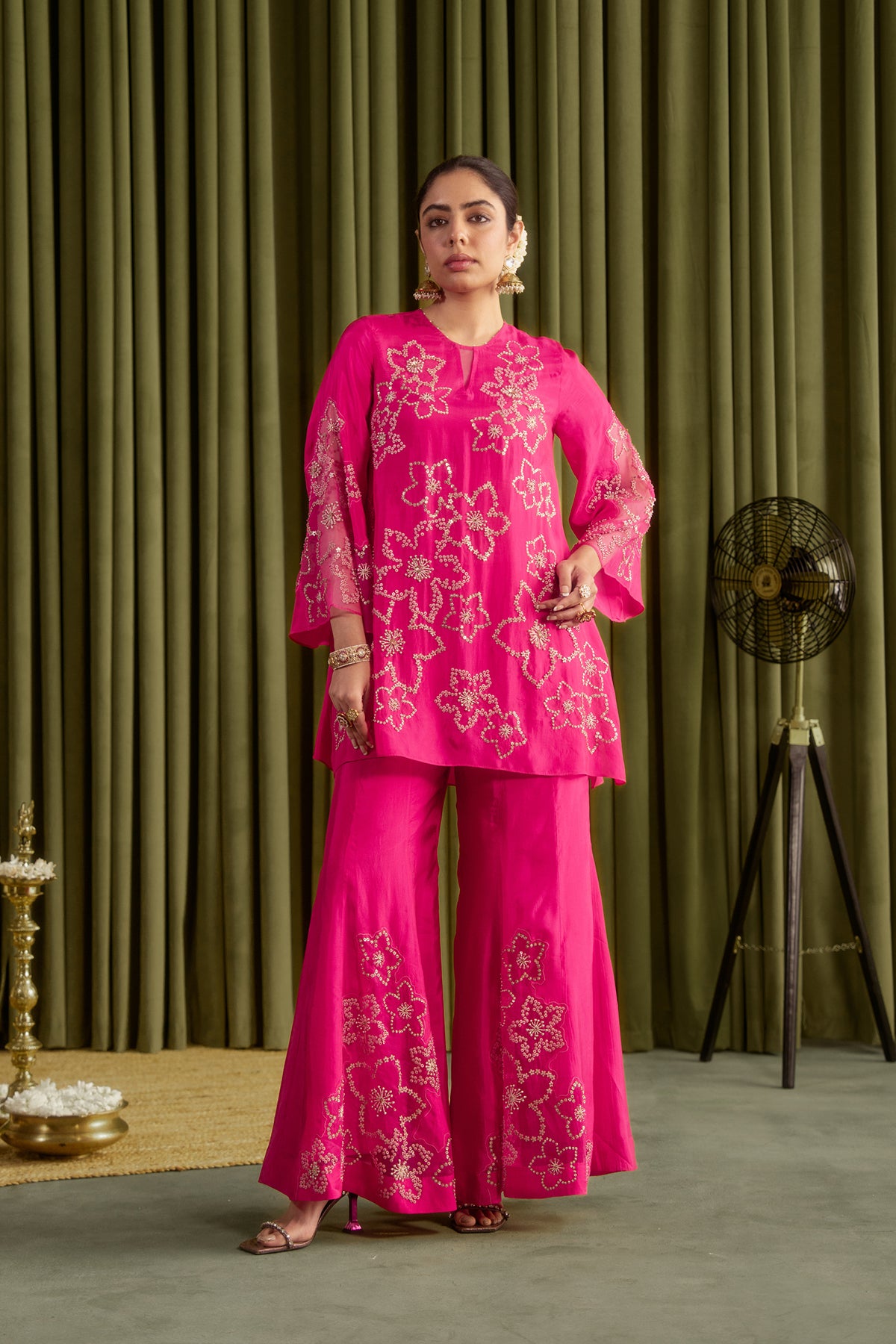 Hot pink sharara set with hand embroidered floral pattern.