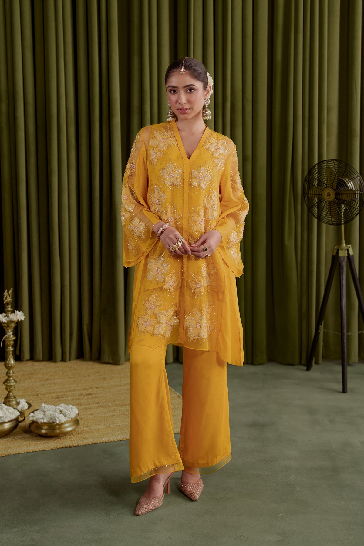 Golden beige co-ord set with embroidered floral pattern.