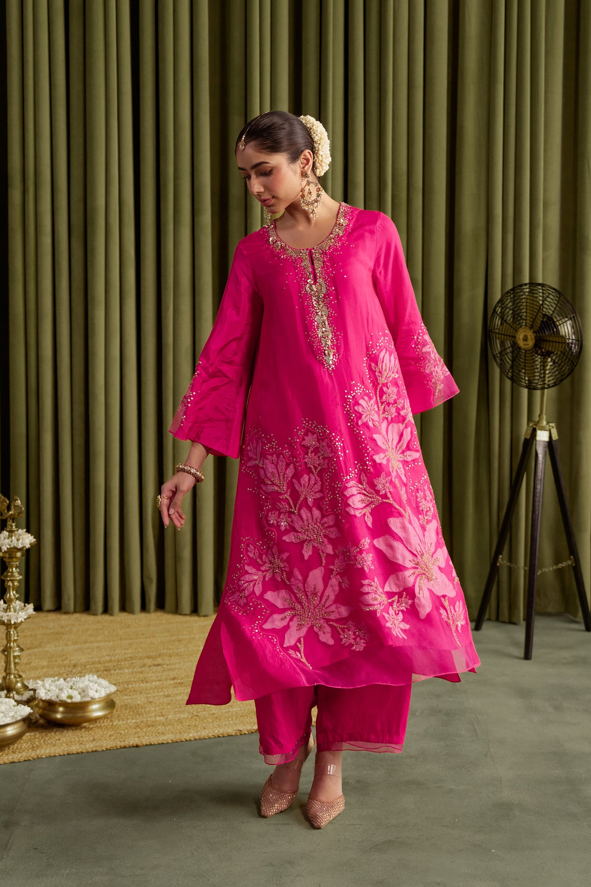 Hot pink kurta set in viscose silk base with embroidered magnolia flower pattern.