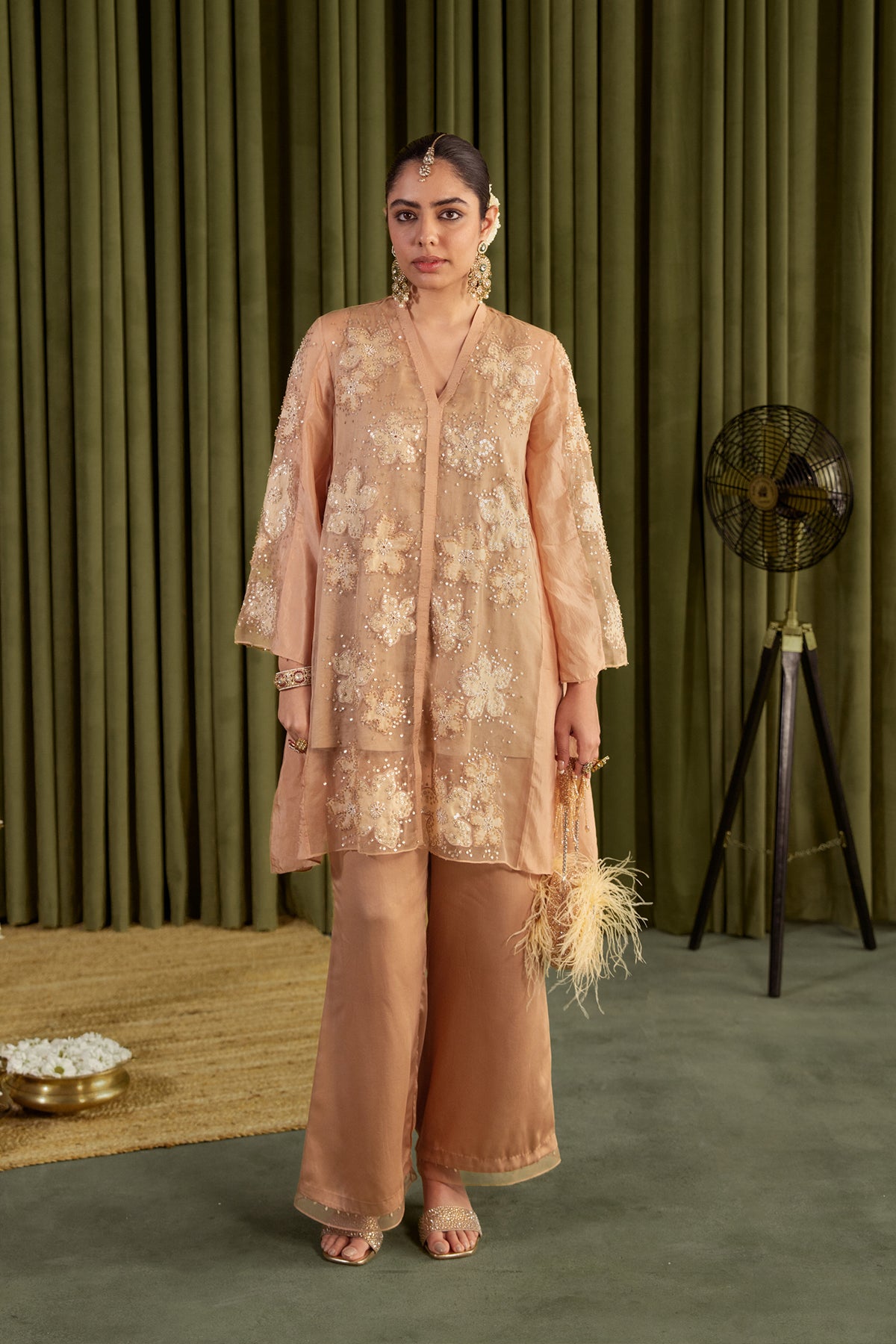 Golden beige co-ord set with embroidered floral pattern.