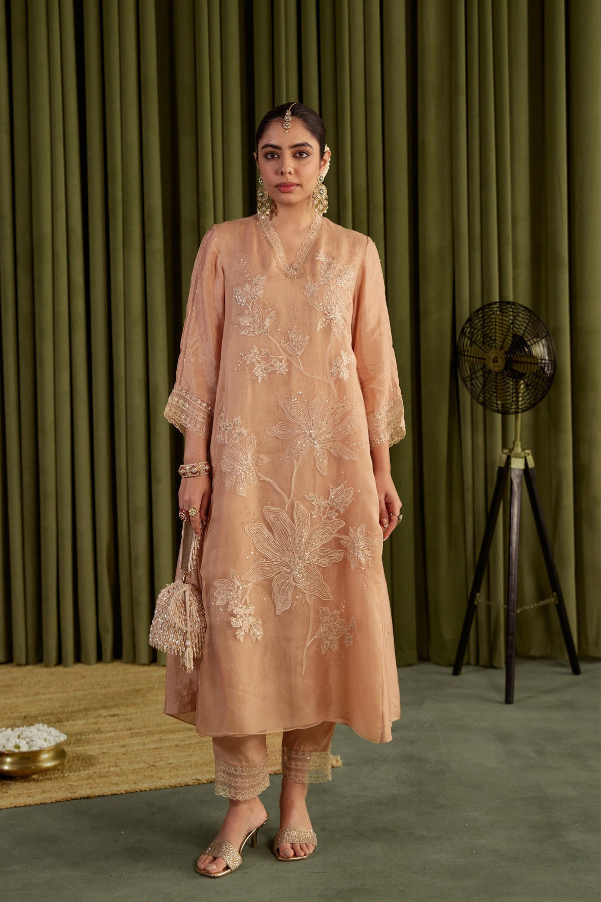 Golden beige kurta set with delicate floral embroidery.