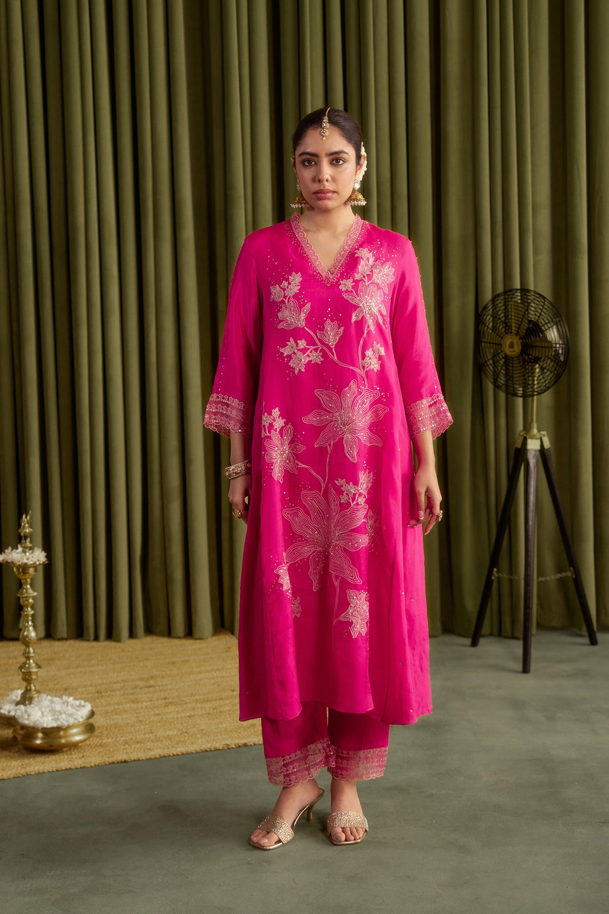 Hot pink kurta set with delicate floral embroidery.