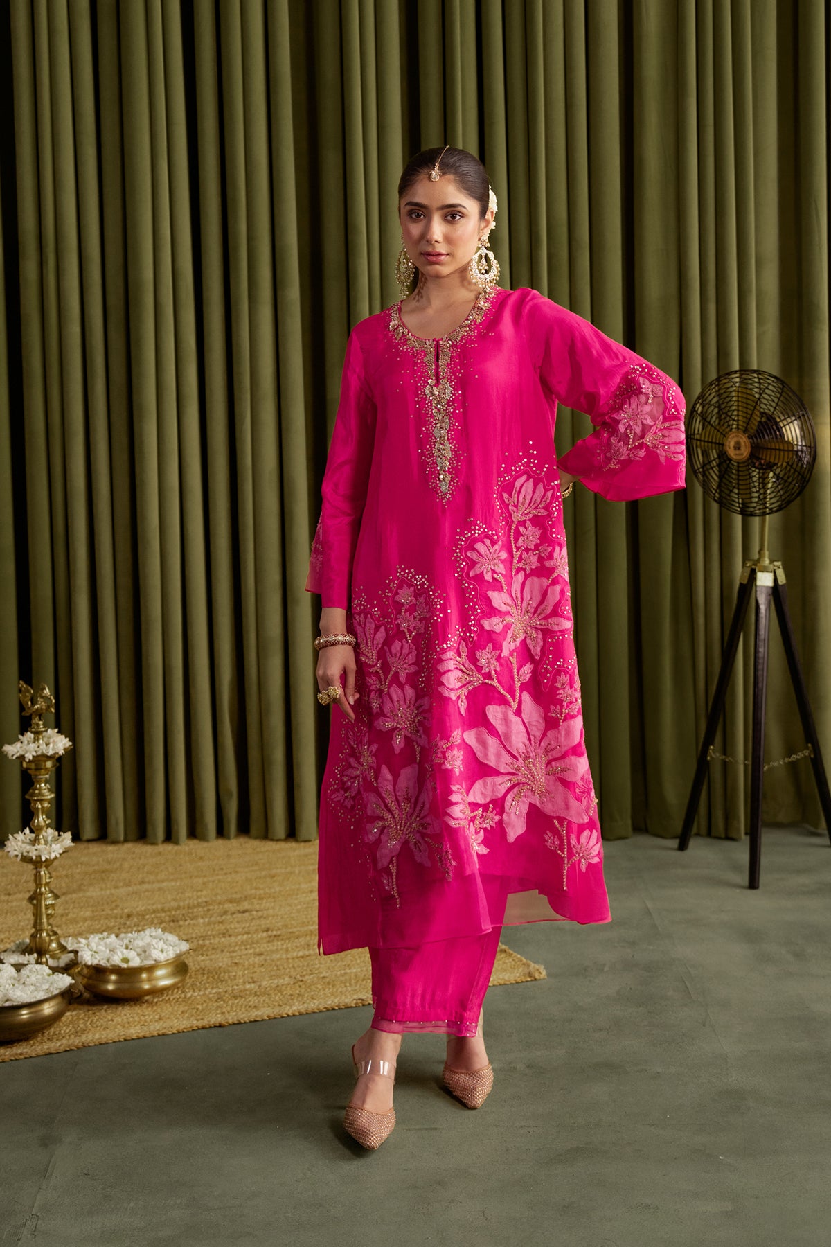 Hot pink kurta set in viscose silk base with embroidered magnolia flower pattern.