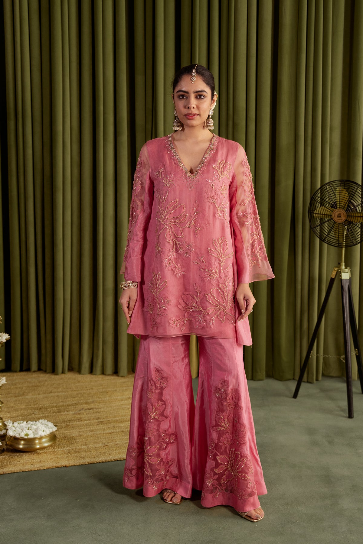 Rose pink sharara set with embroidered magnolia flower pattern.