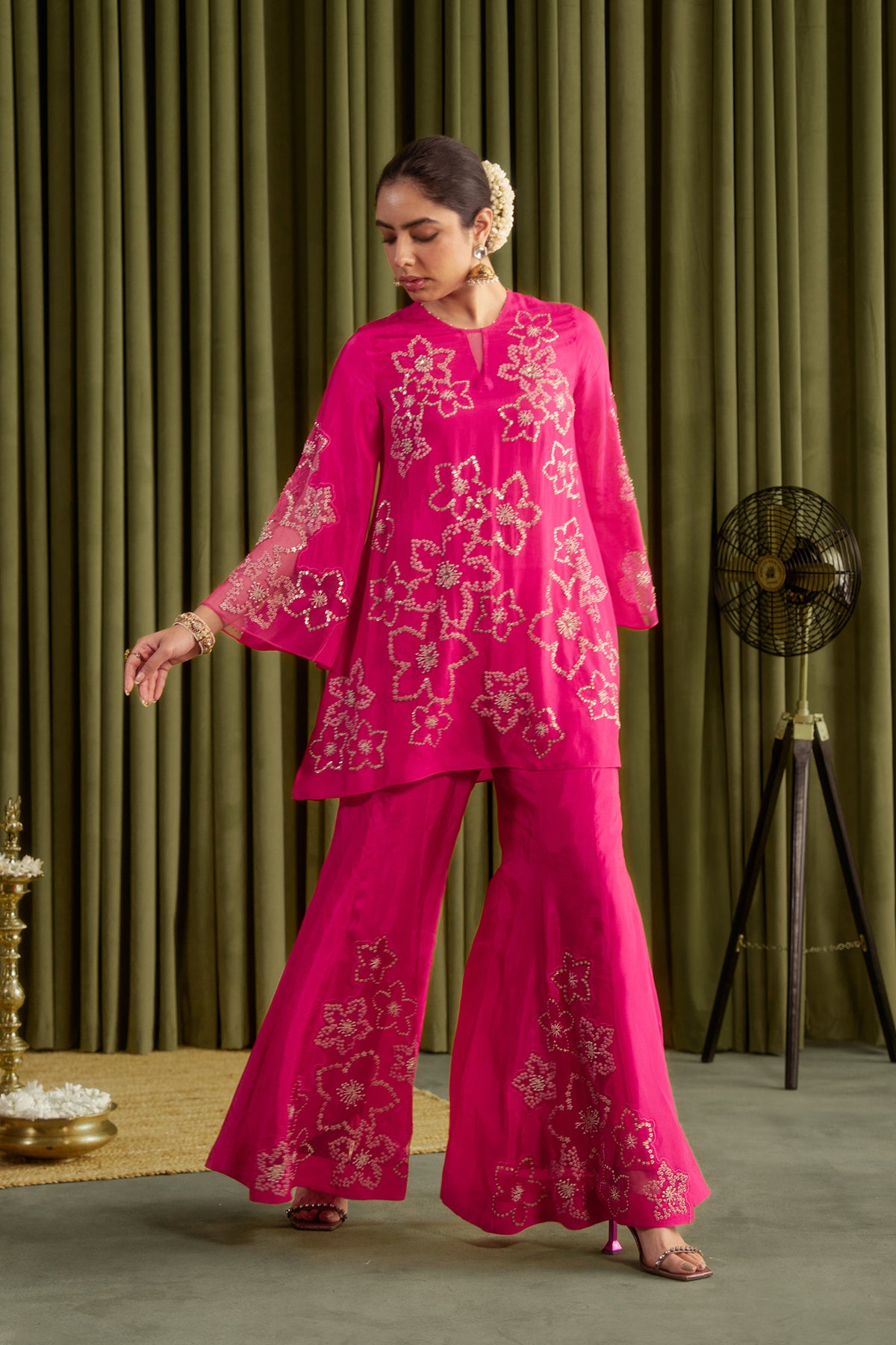 Hot pink sharara set with hand embroidered floral pattern.
