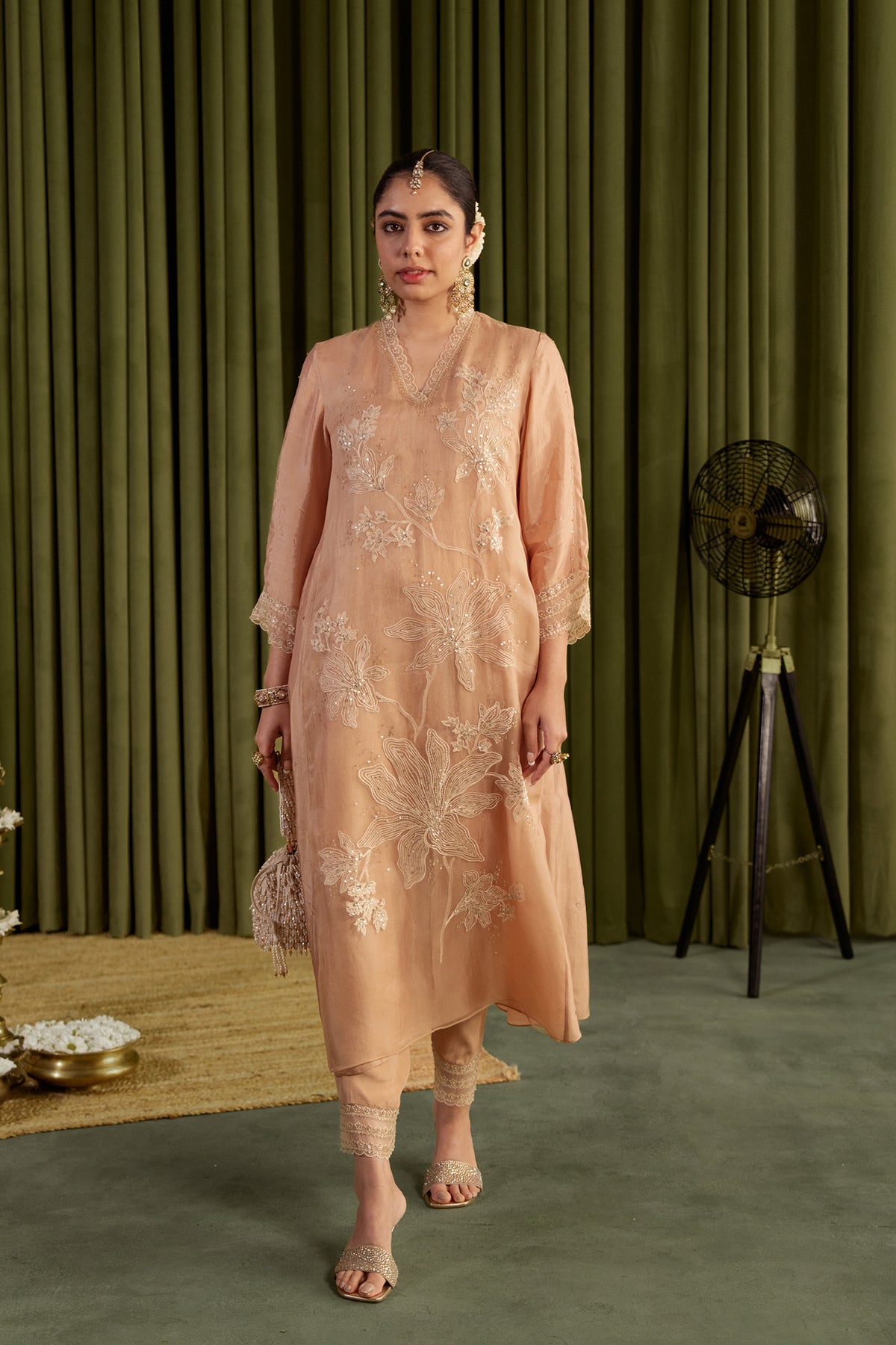 Golden beige kurta set with delicate floral embroidery.