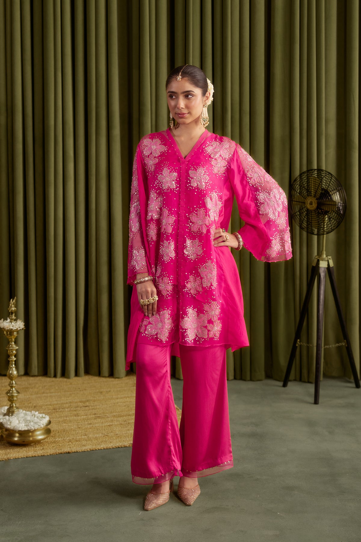 Hot pink co-ord set with embroidered floral pattern.