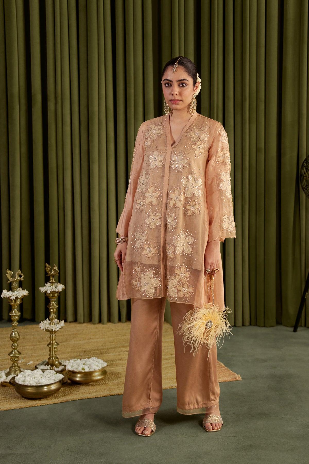 Golden beige co-ord set with embroidered floral pattern.