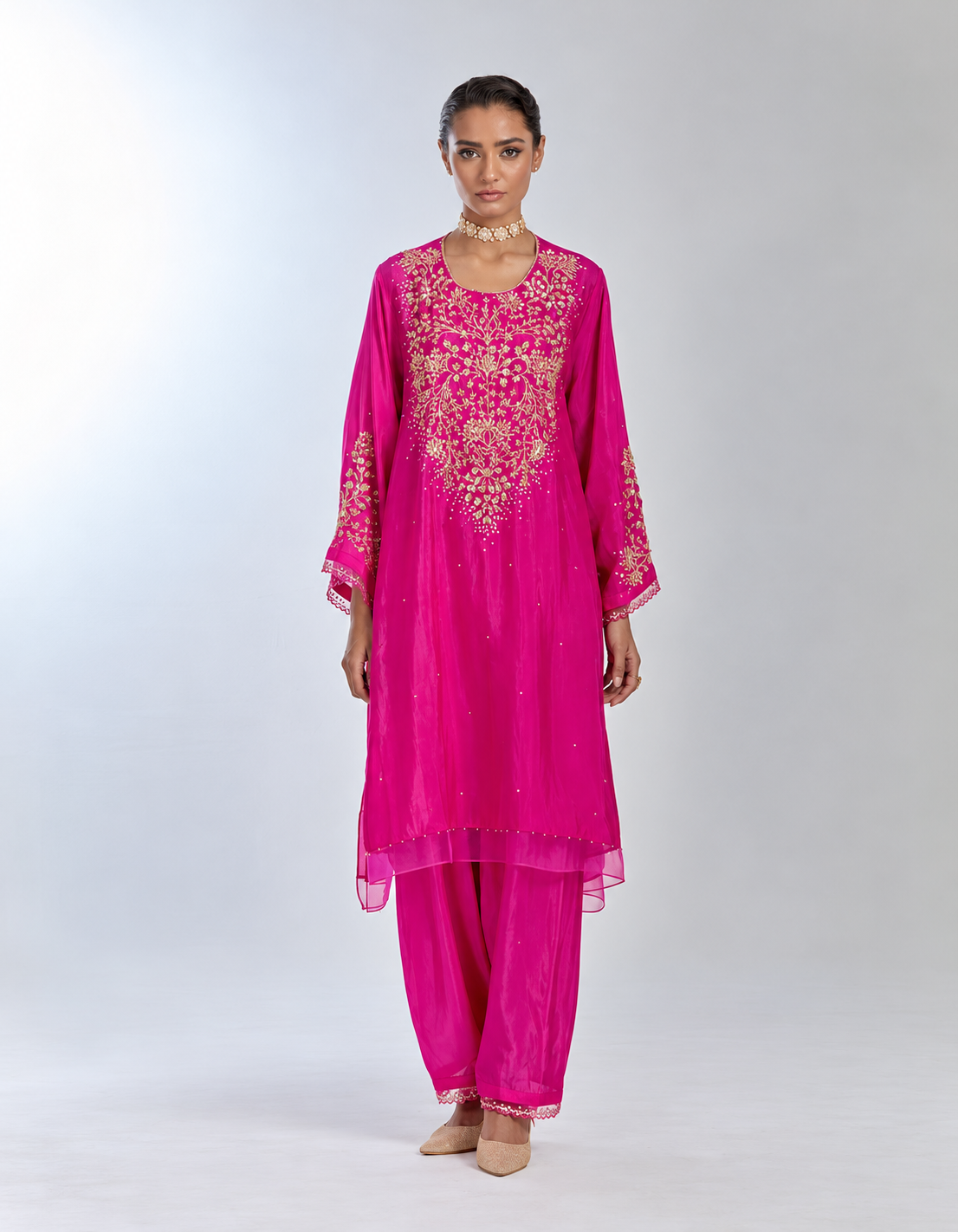 Hotpink color silk salwar set with intricate sequins and crystal embroidery on yoke and sleeves