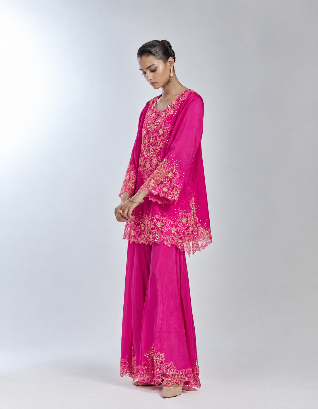 Hot pink color sharara set in silk with delicate floral thread embroidery highlighted with sequins and beads