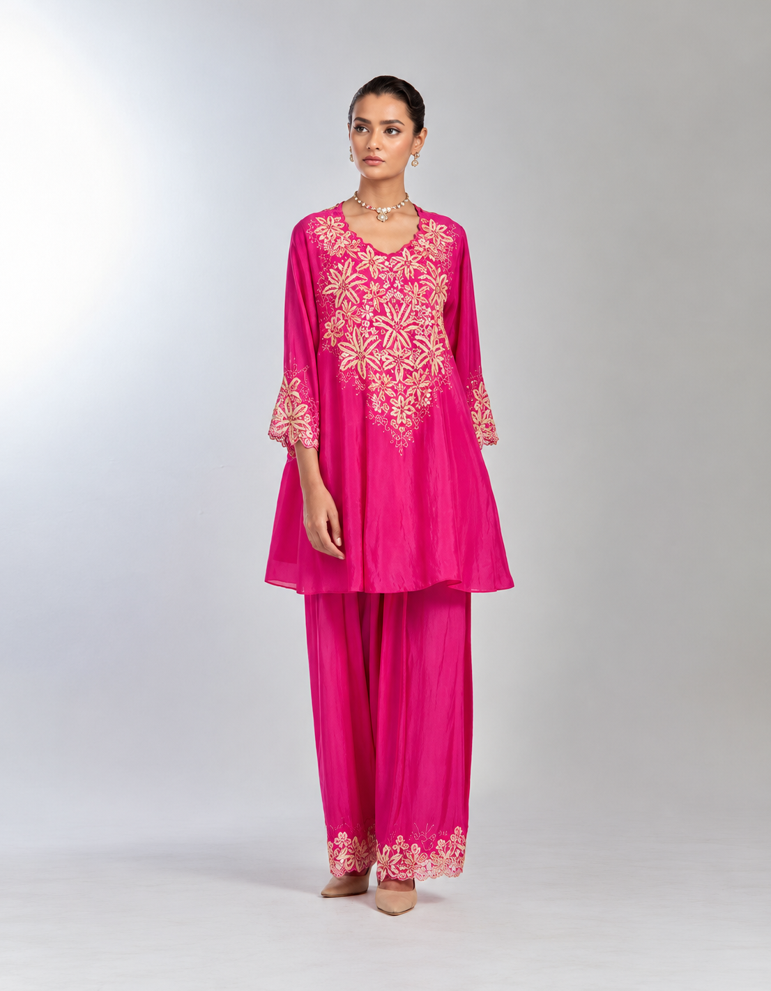 Hot pink silk salwar set with intricate hand embroidered yoke