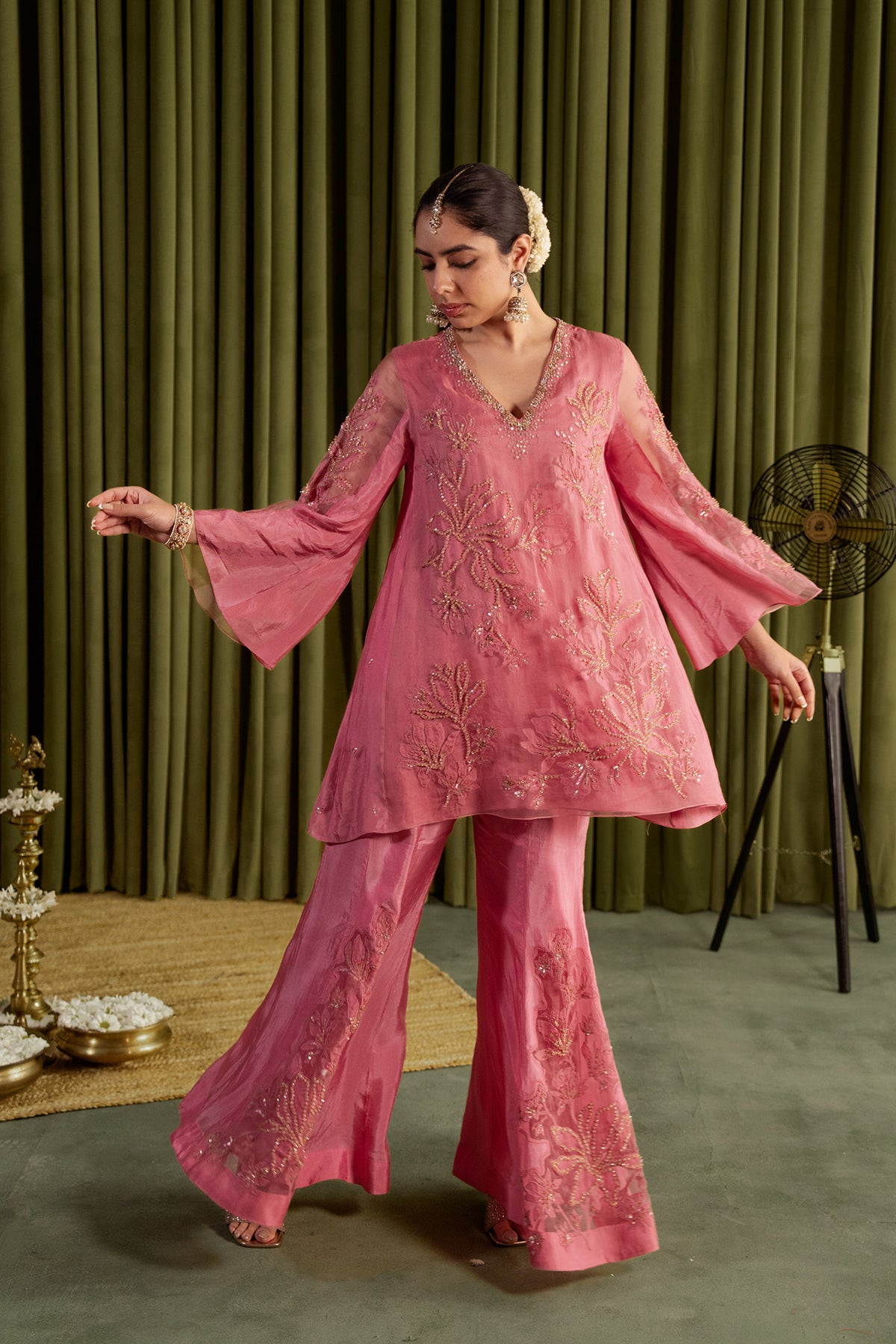 Rose pink sharara set with embroidered magnolia flower pattern.