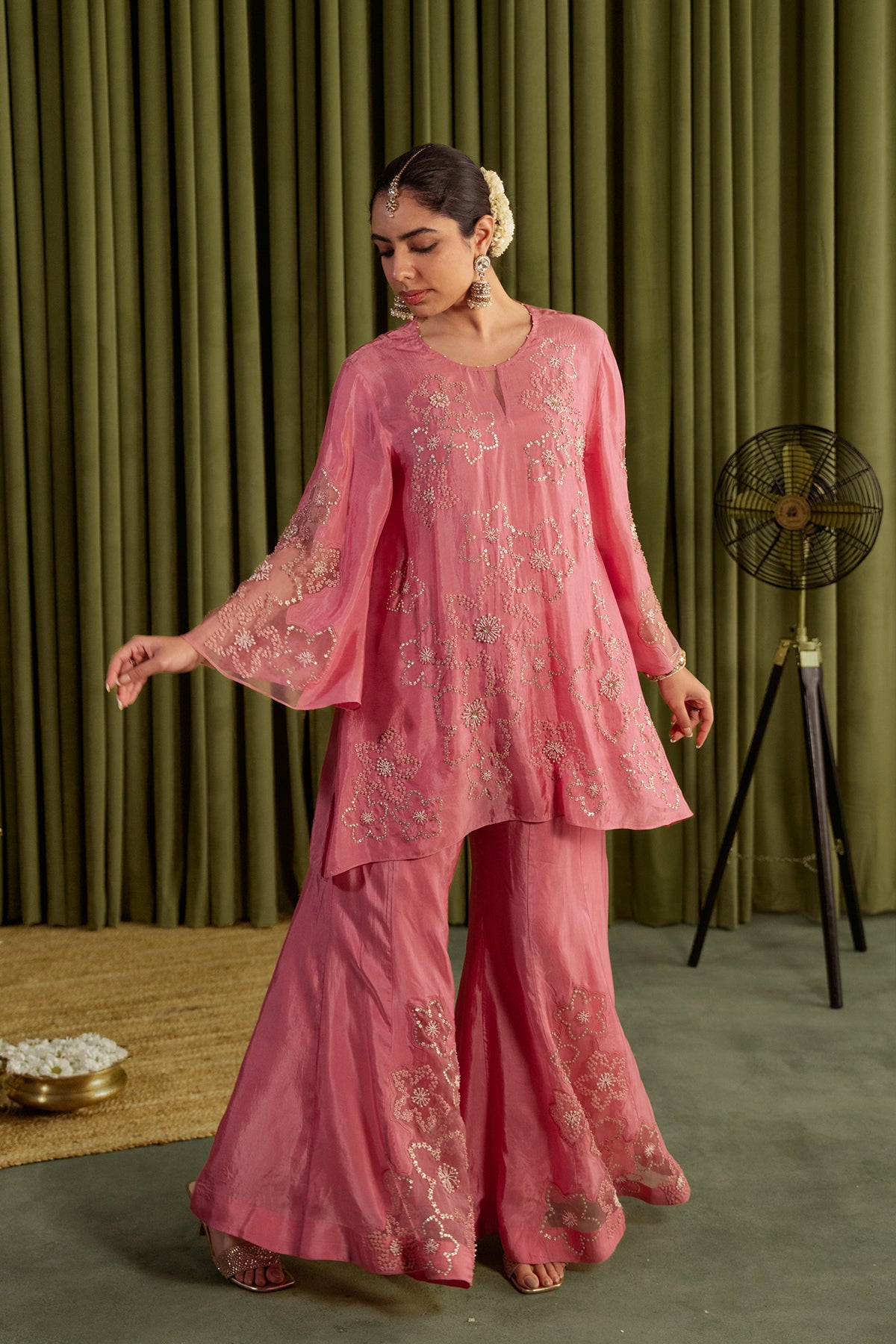 Rose pink sharara set with hand embroidered floral pattern.