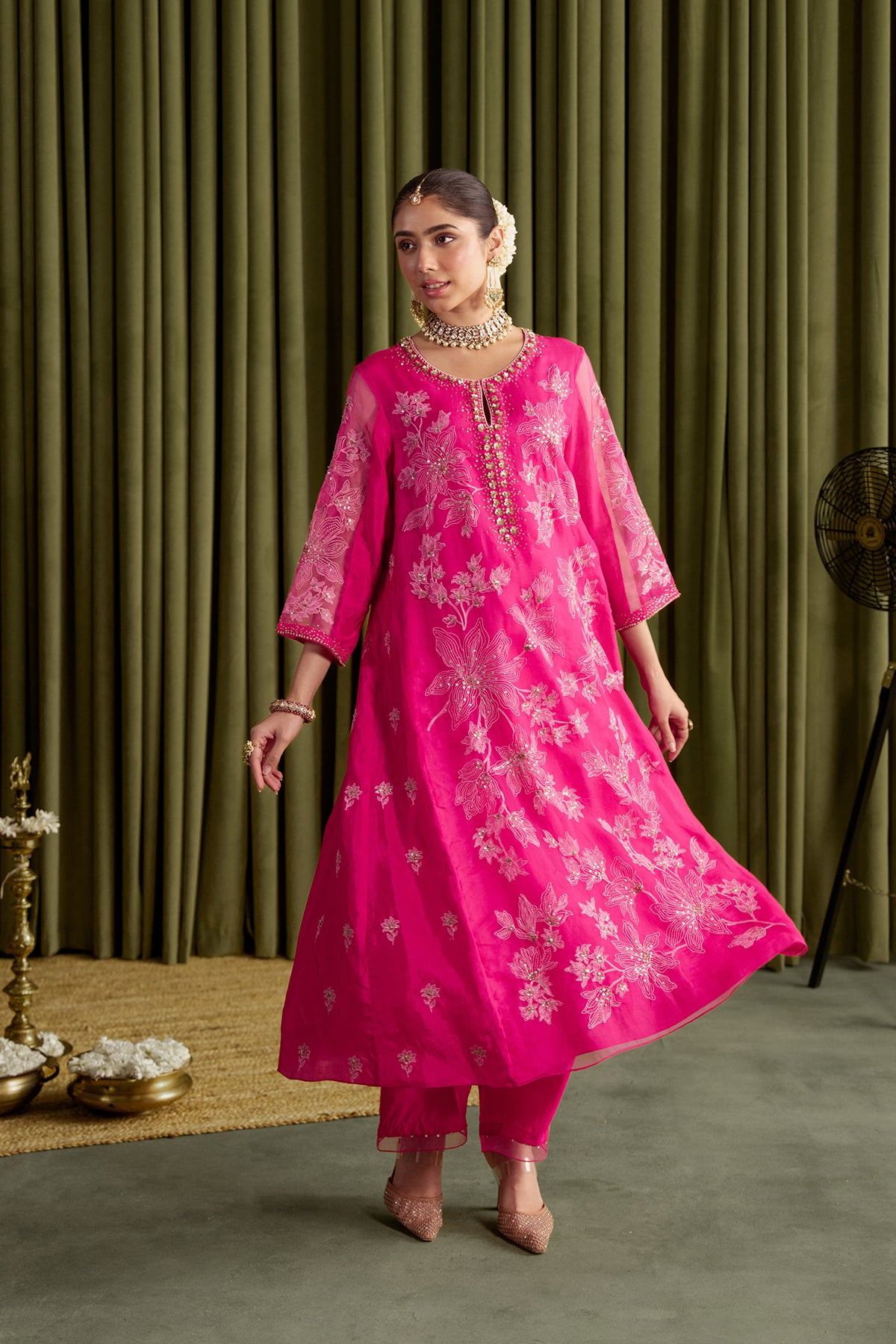 Hot pink kalidar kurta set with delicate floral embroidery.