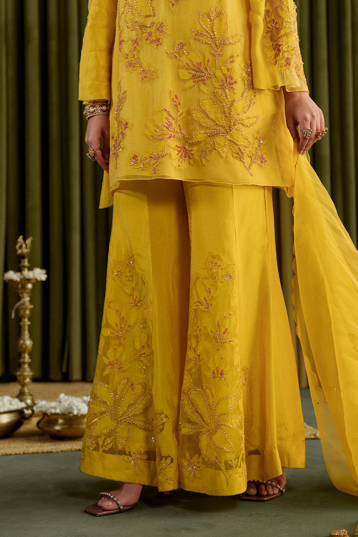 Mango sharara set with embroidered magnolia flower pattern.