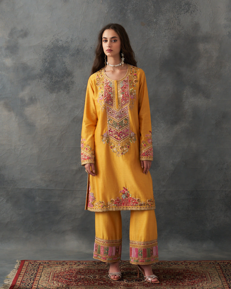 Velvet patchwork Knee length yellow kurta with pants & organza dupatta.