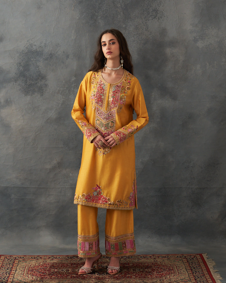 Velvet patchwork Knee length yellow kurta with pants & organza dupatta.