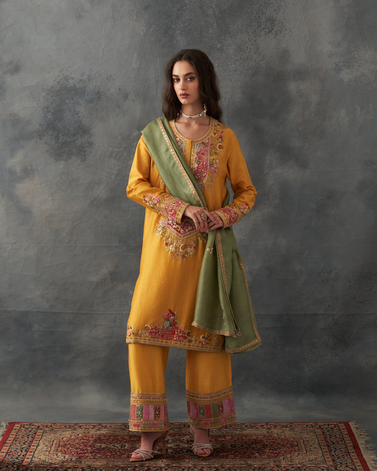 Velvet patchwork Knee length yellow kurta with pants & organza dupatta.