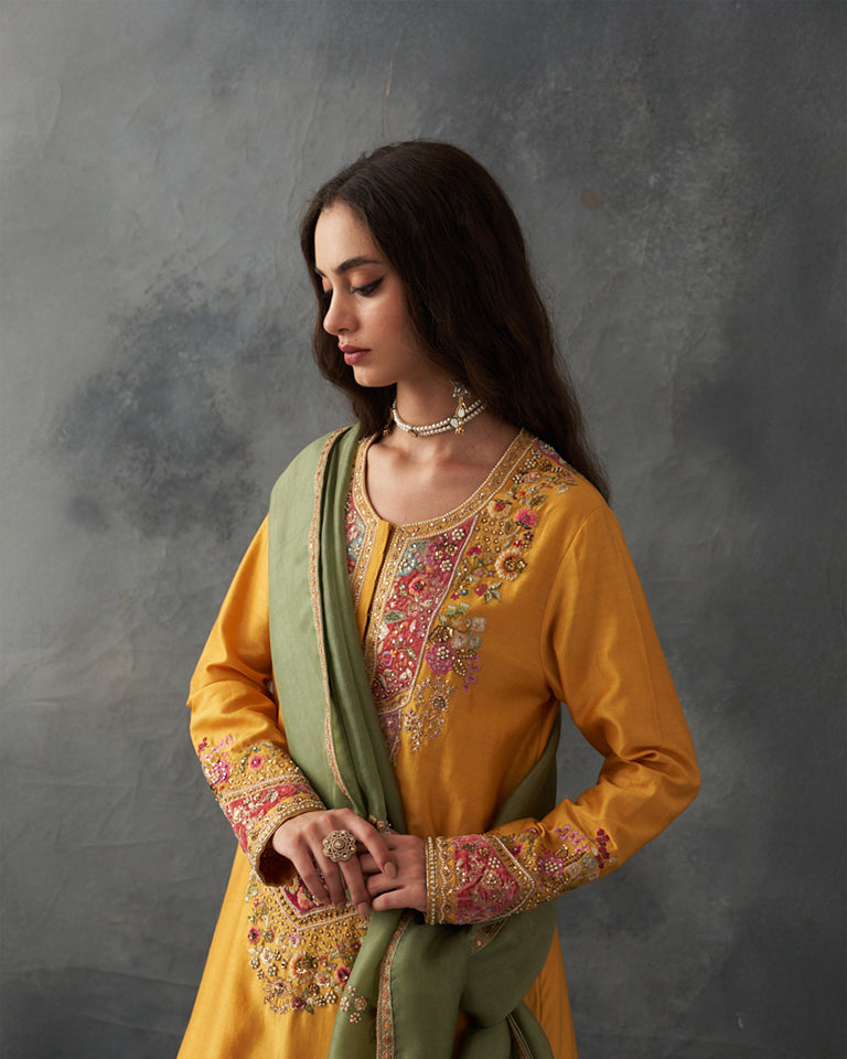 Velvet patchwork Knee length yellow kurta with pants & organza dupatta.