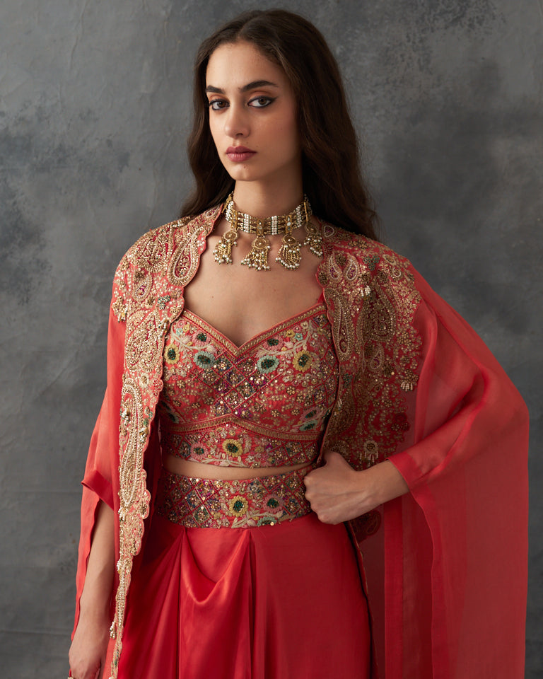 Gulrez cape with embroidered bustier & draped skirt.