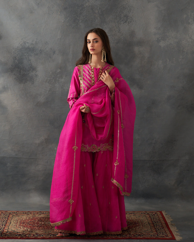 Gulrez short kurti with sharara & dupatta.