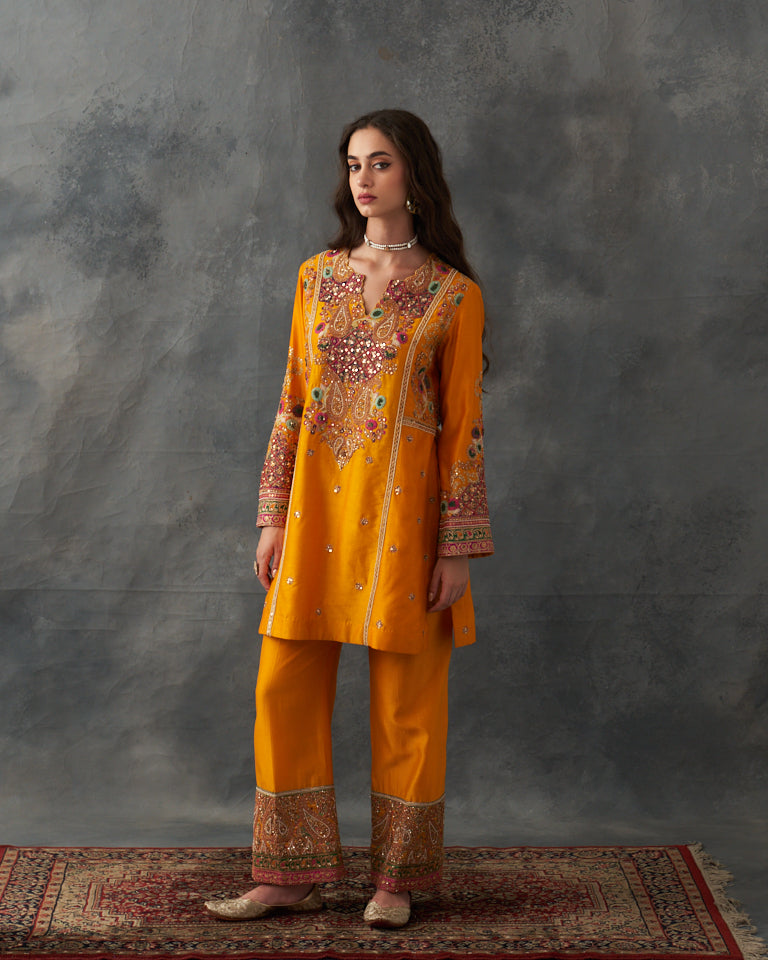 Gulrez short kurti with straight cut pants.