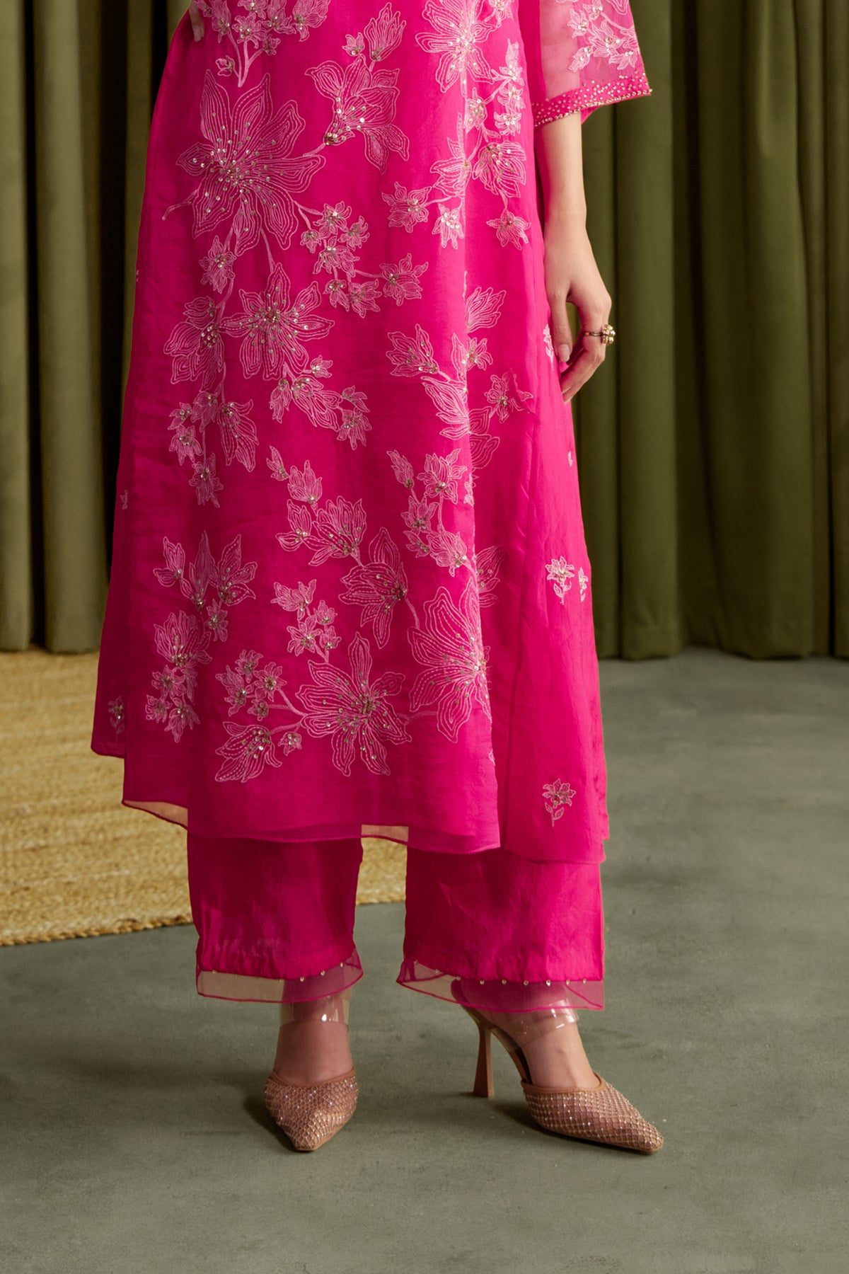 Hot pink kalidar kurta set with delicate floral embroidery.