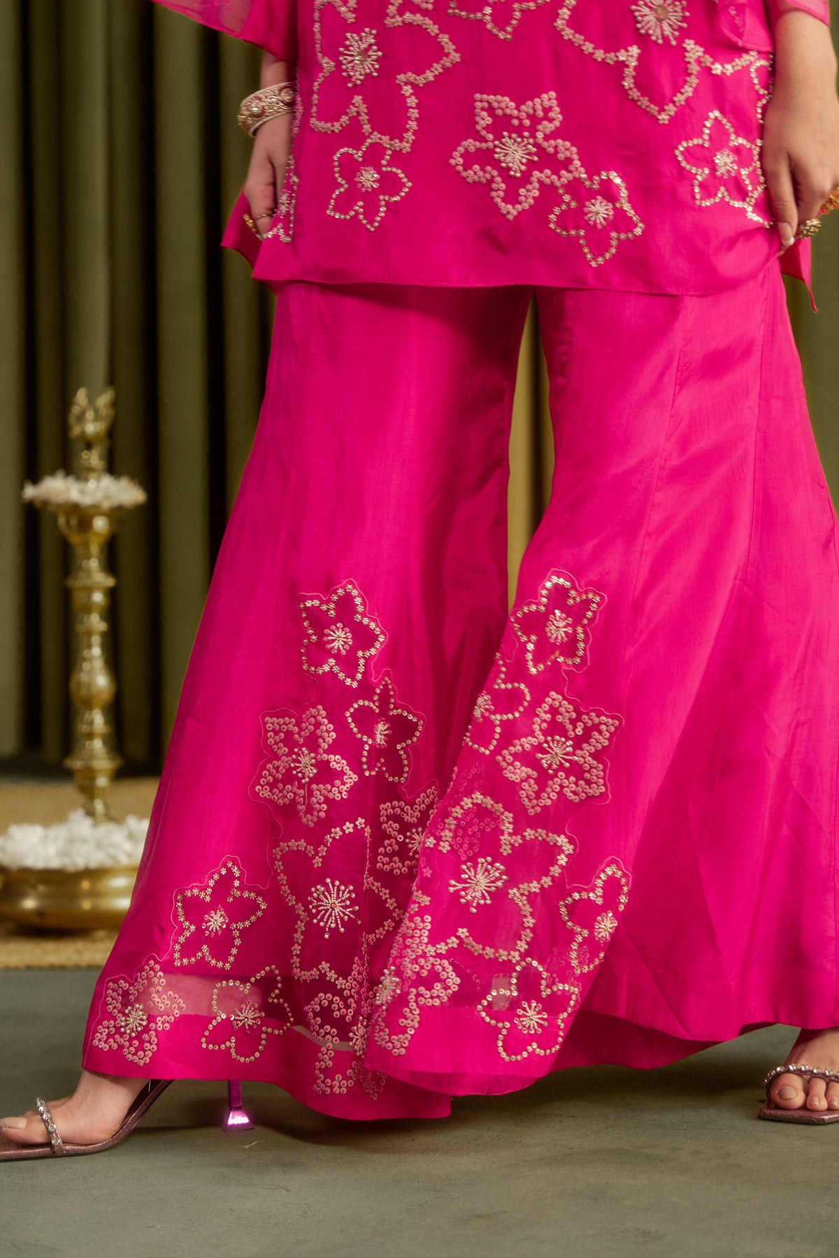 Hot pink sharara set with hand embroidered floral pattern.