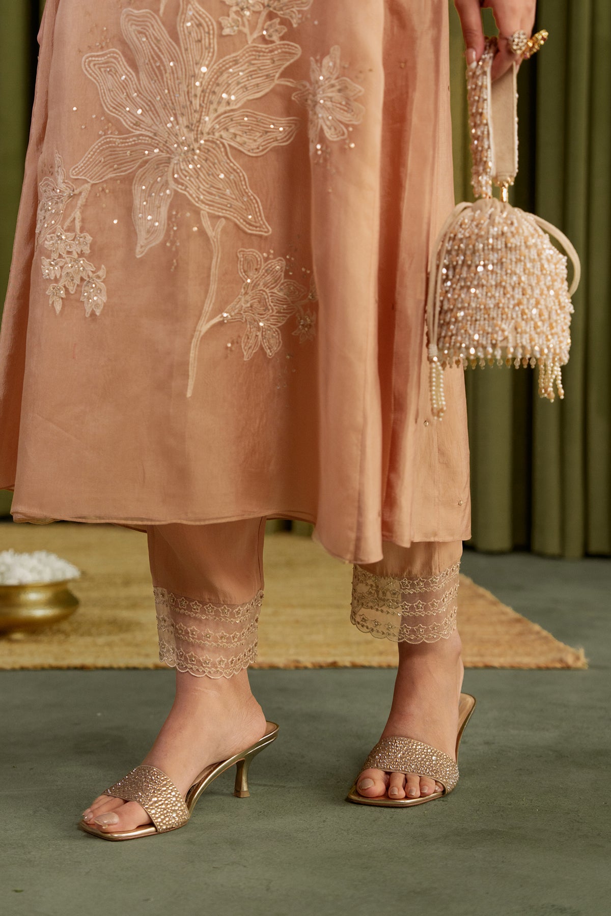 Golden beige kurta set with delicate floral embroidery.