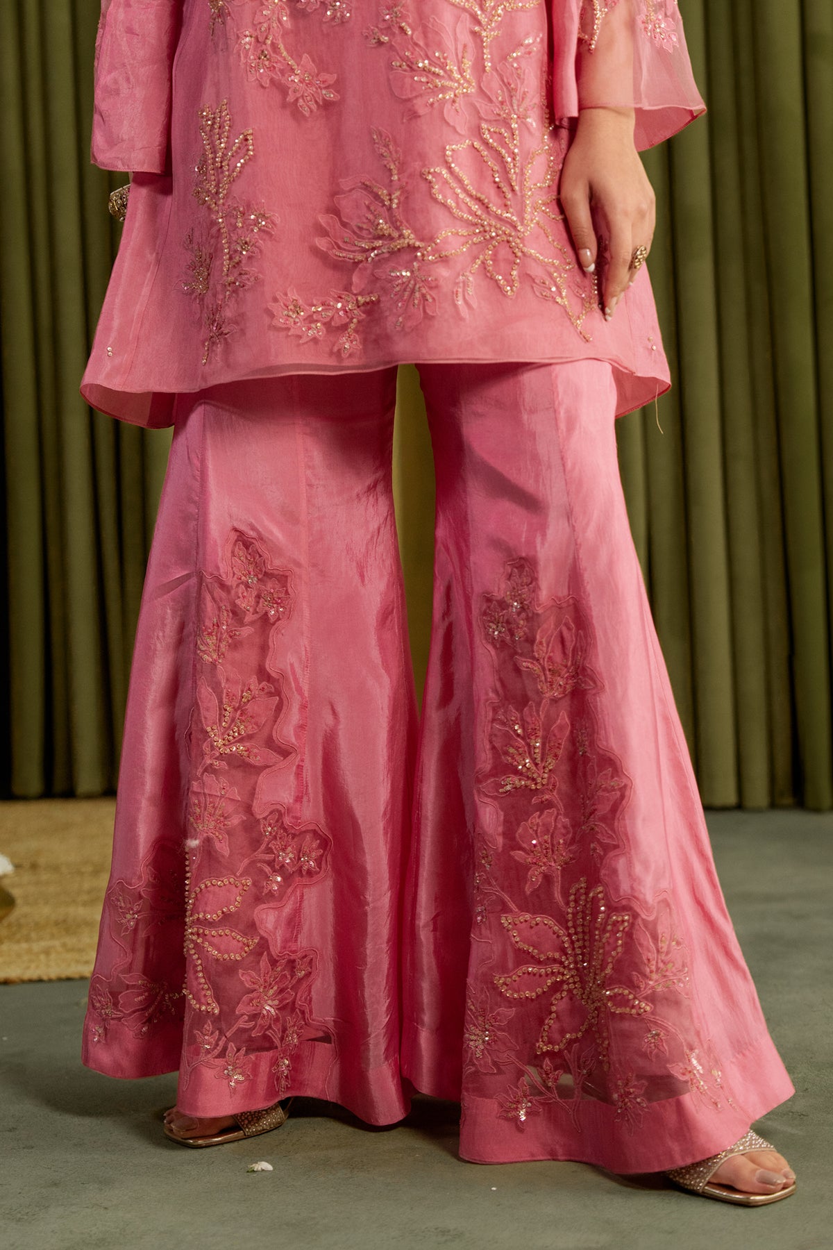 Rose pink sharara set with embroidered magnolia flower pattern.