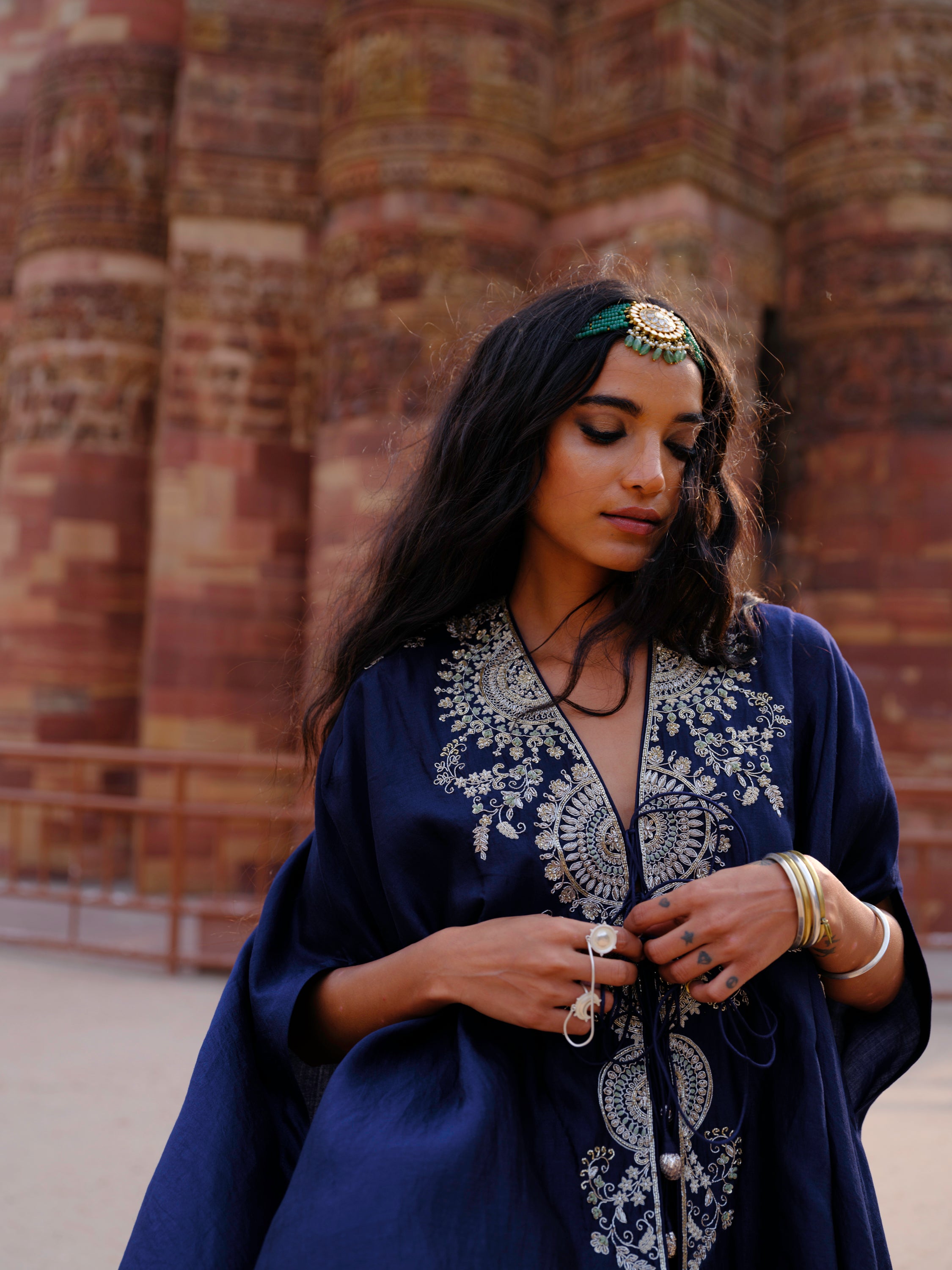 Featuring a cape in silk base with  zardosi embroidery