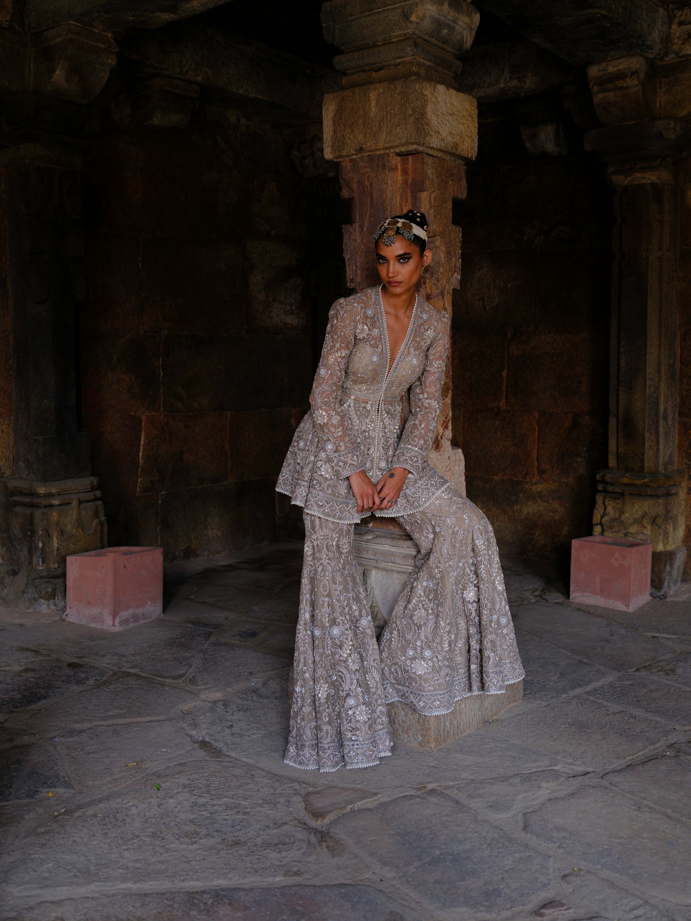 Featuring a peplum in net base with zari embroidery.