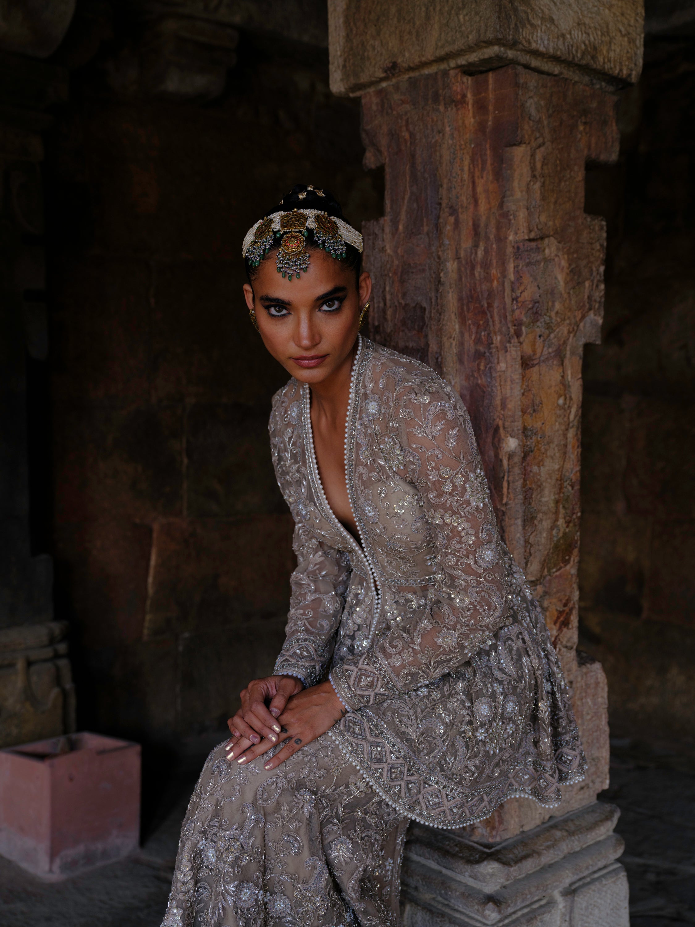 Featuring a peplum in net base with zari embroidery.