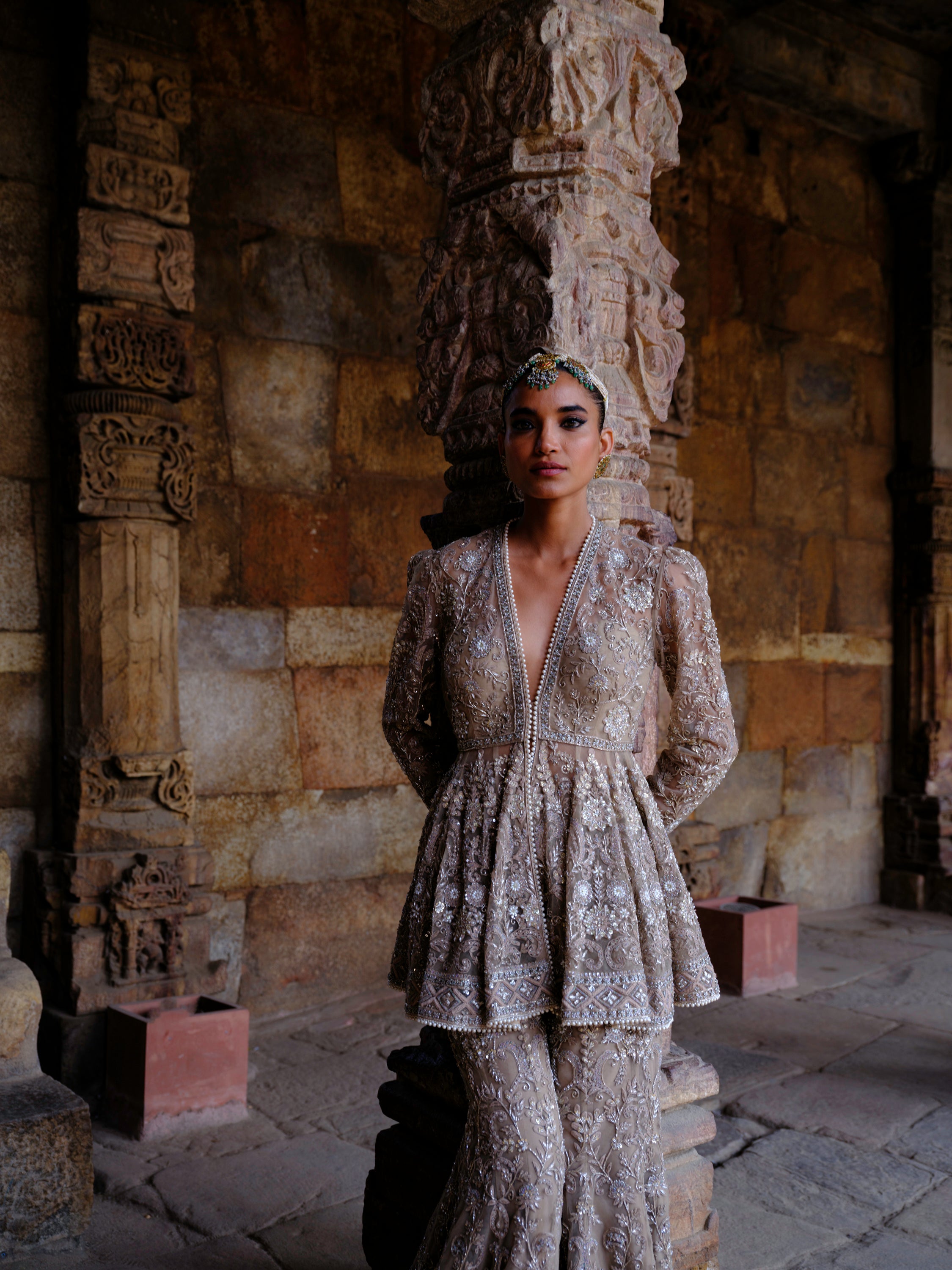 Featuring a peplum in net base with zari embroidery.