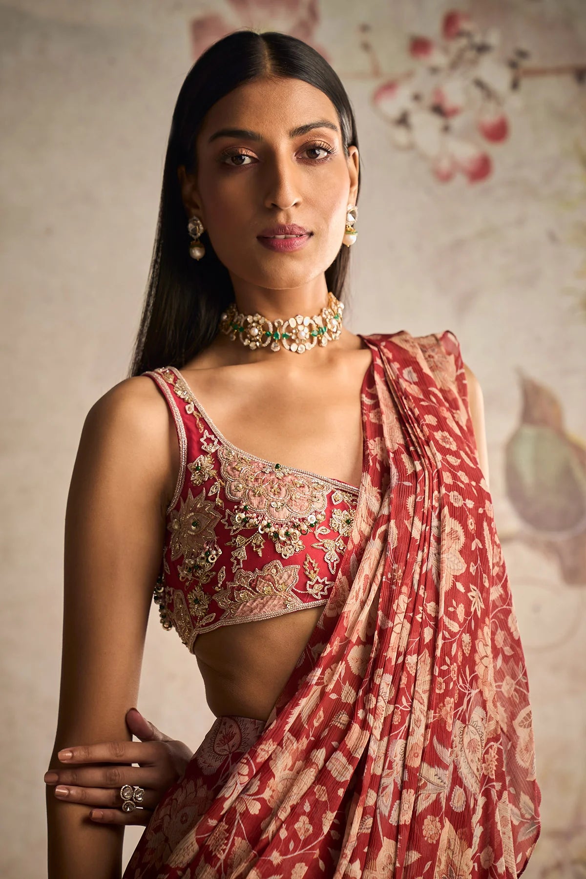 Red ochre net applique embroidered blouse and chiffon draped ruffle saree