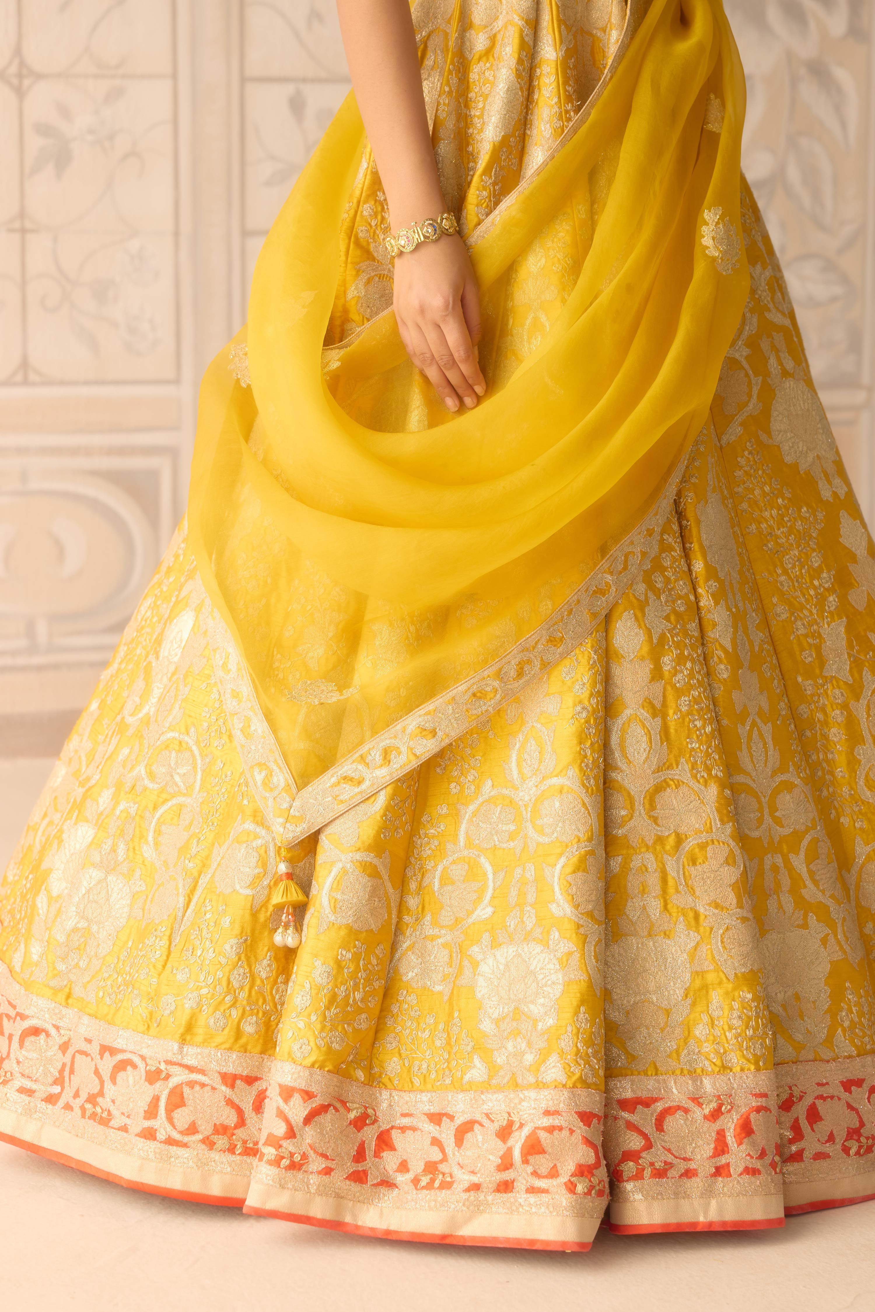 Raw silk dandelion yellow gold applique and thread embroidered lehenga set with organza dupatta